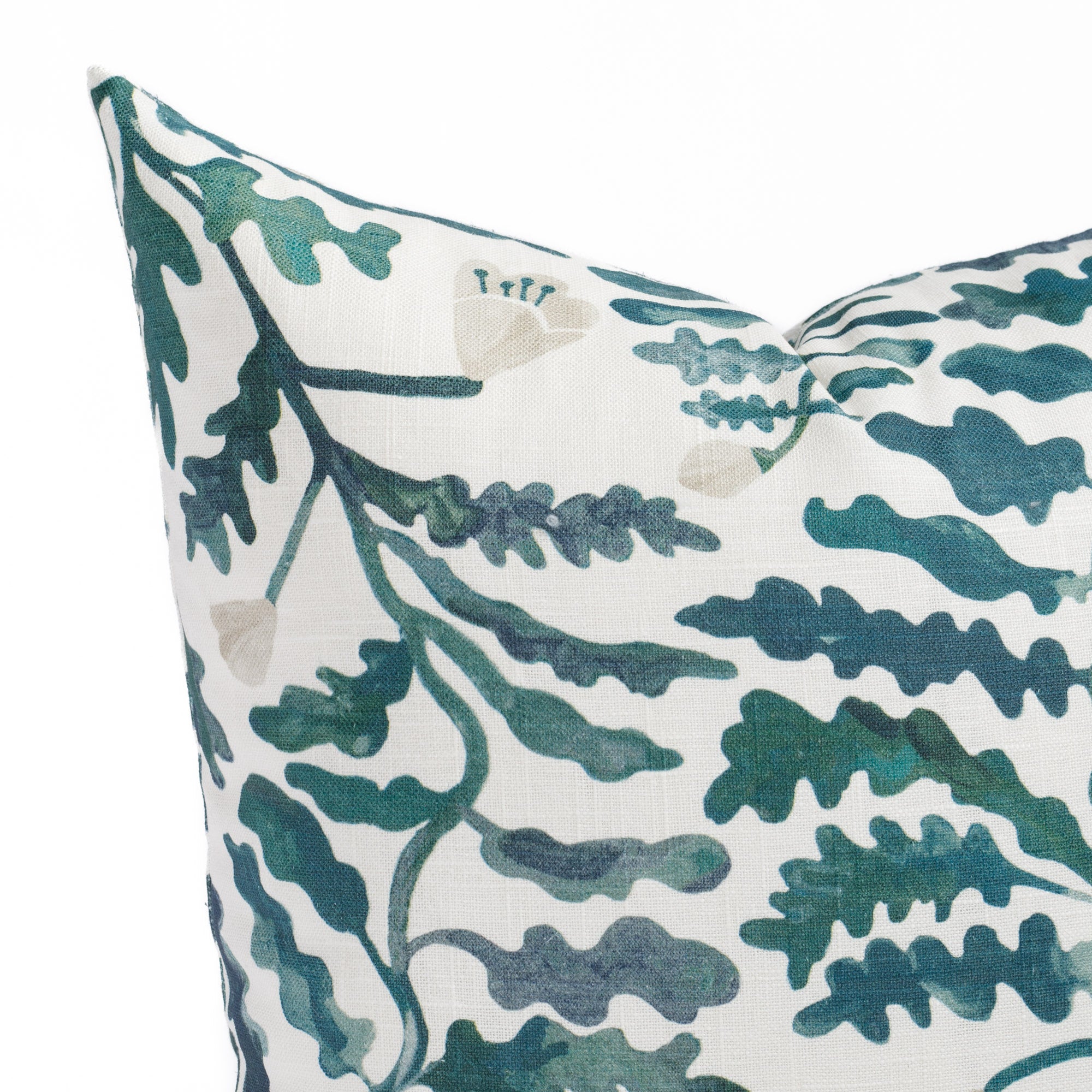 a green and white leafy botanical throw pillow: close up view
