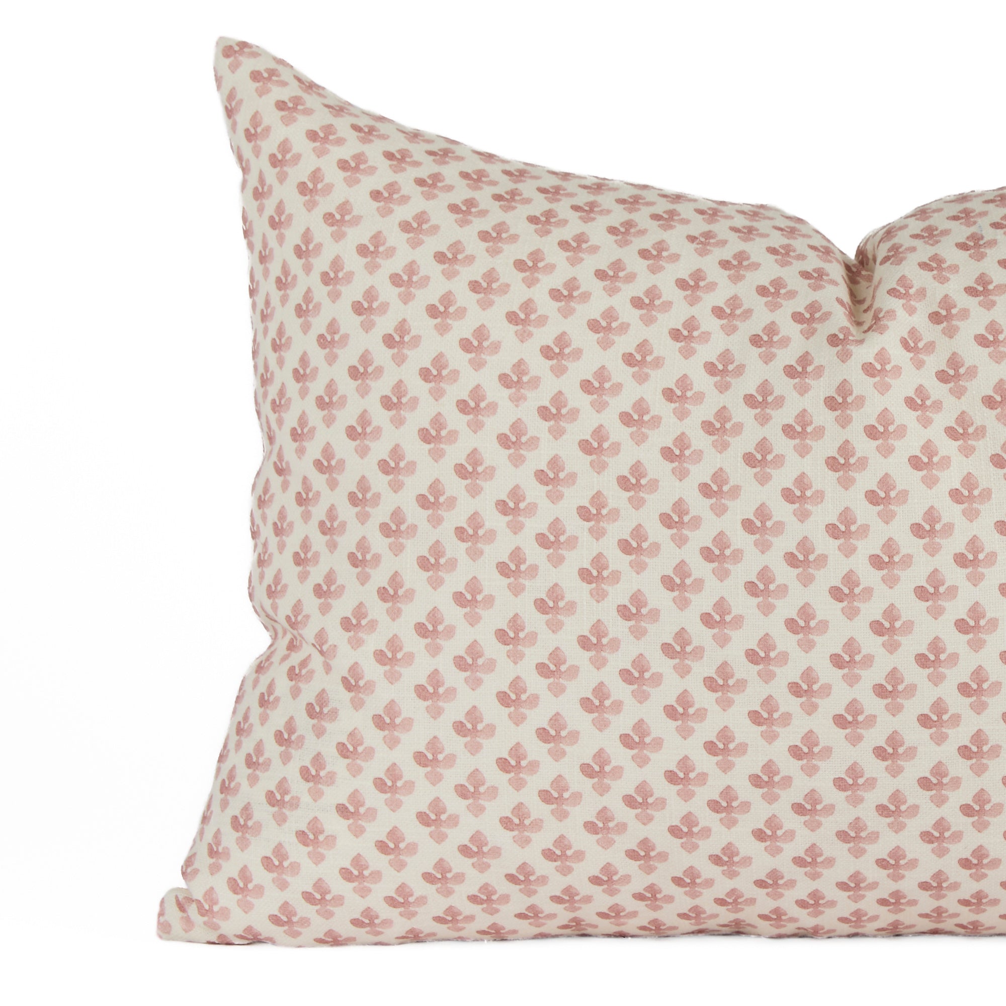 Close-up of Lyra Berry lumbar pillow by Tonic Living — delicate white and dark rose floral block print design.