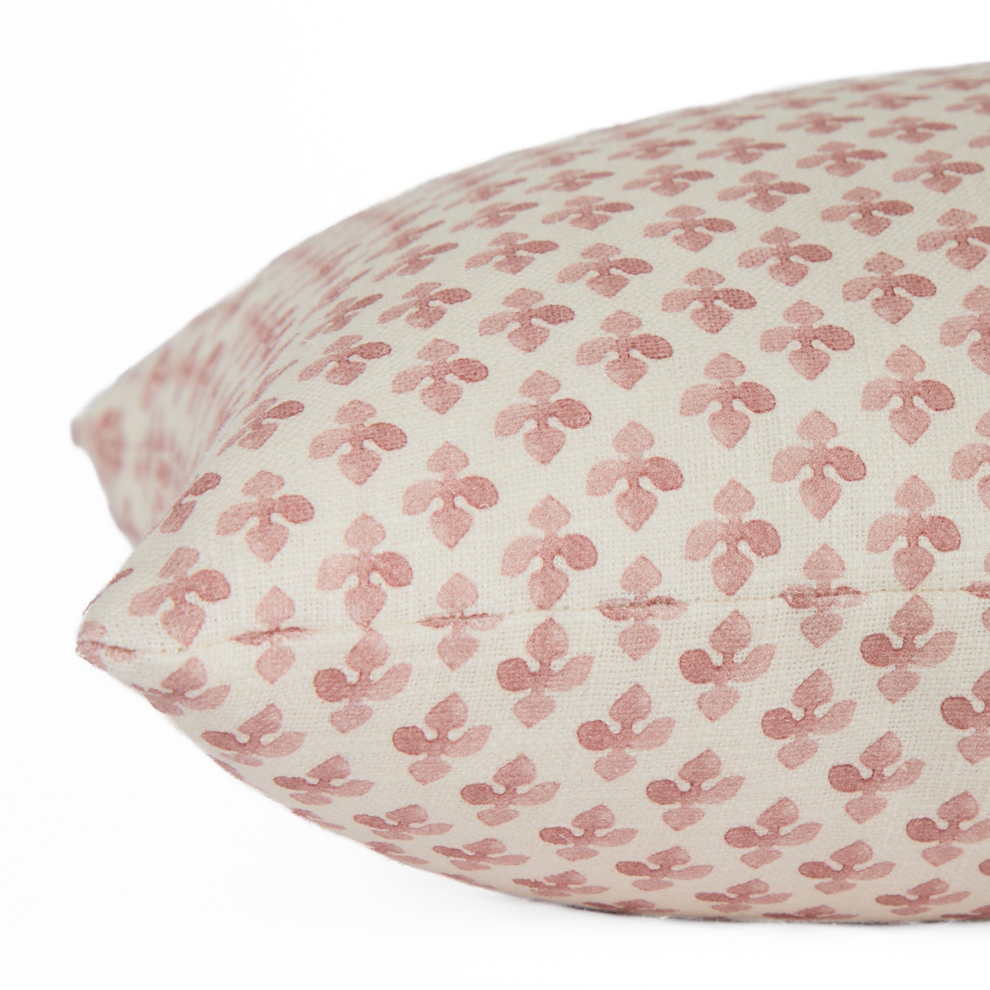 Close-up side view of Lyra Berry lumbar cushion by Tonic Living — floral block print in white and dark rose tones.