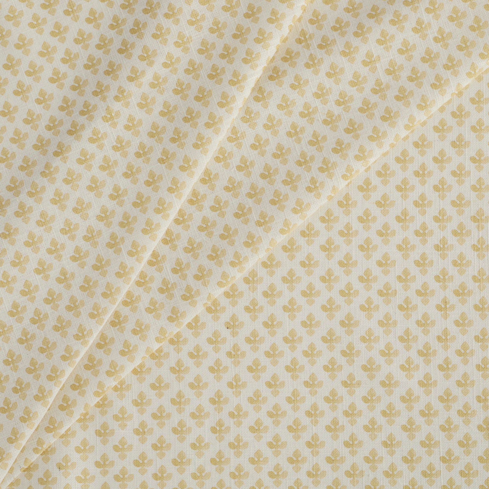 Tonic Living Lyra Fabric, Butter Yellow — linen-blend drapery fabric with a white and yellow floral block print design.