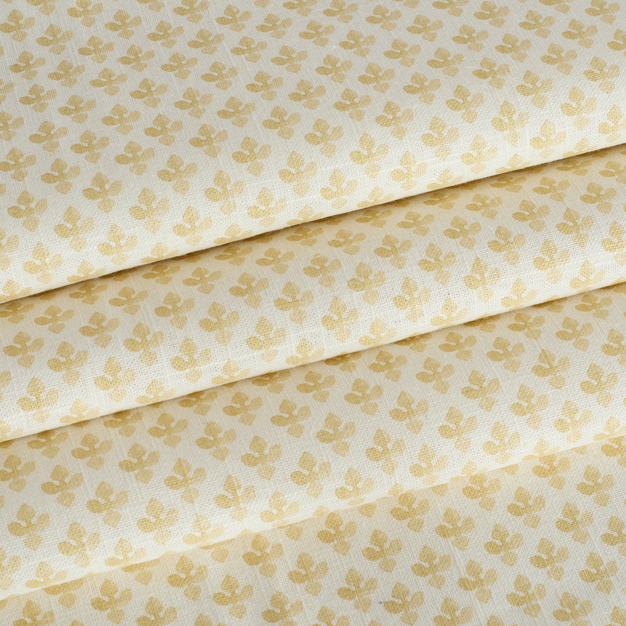 Lyra Butter Yellow roman shade fabric by Tonic Living — lightweight linen-blend fabric with a white and yellow floral block print.