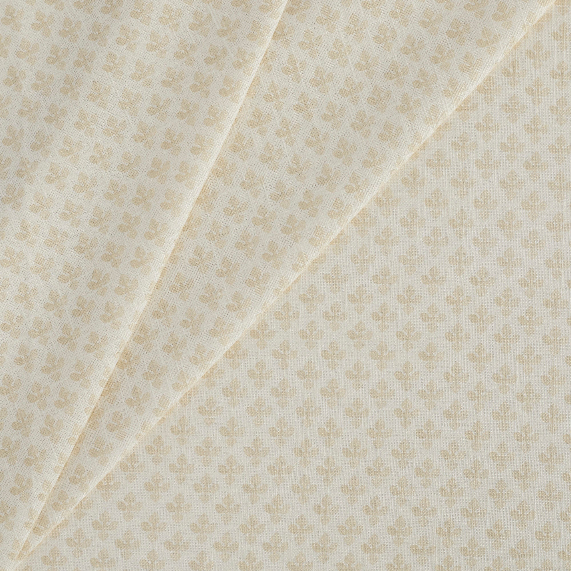 Tonic Living Lyra Fabric, Parchment — linen-blend drapery fabric in neutral tones with a warm white and beige floral block print.