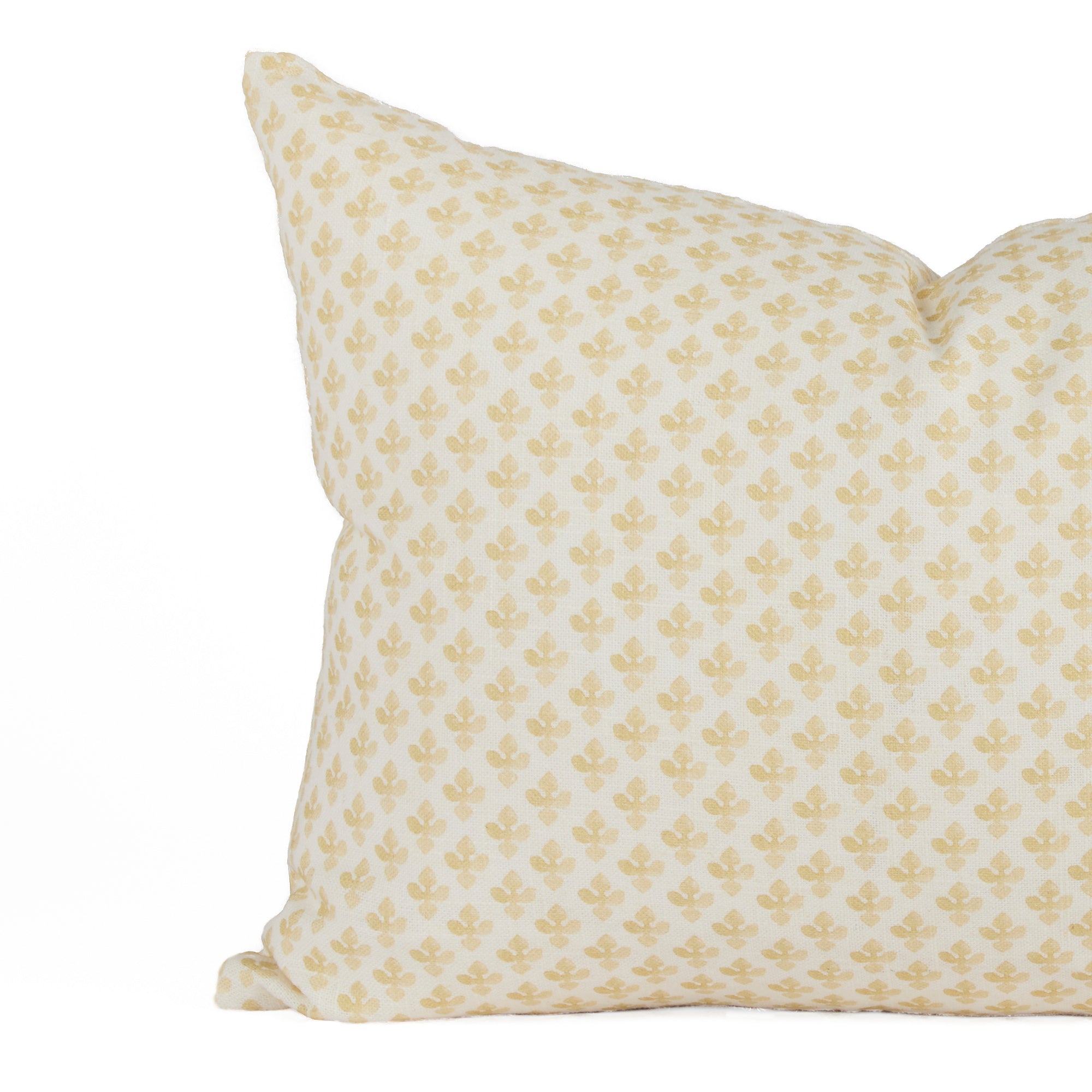 Close-up of Lyra Butter Yellow lumbar pillow by Tonic Living — delicate white and yellow floral block print design.