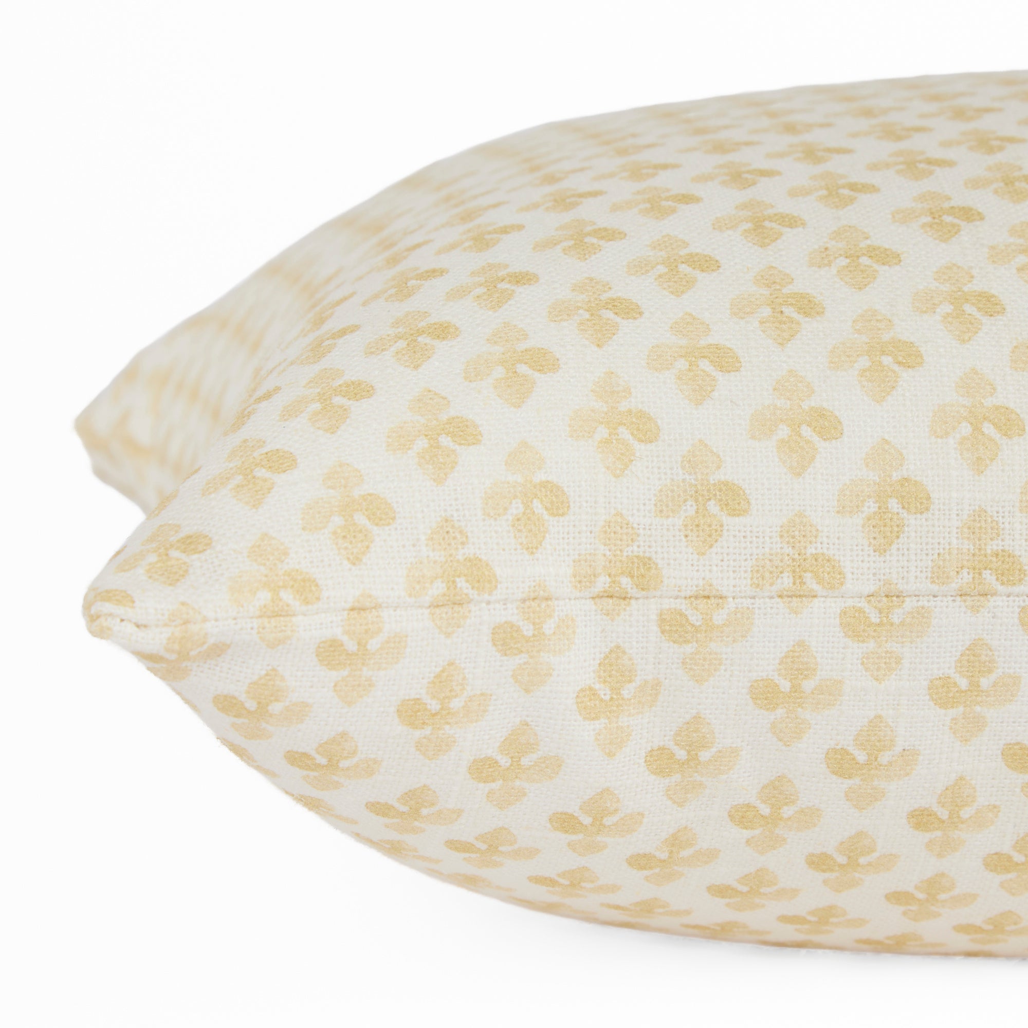 Close-up side view of Lyra Butter Yellow lumbar cushion by Tonic Living — floral block print in warm yellow and white tones.