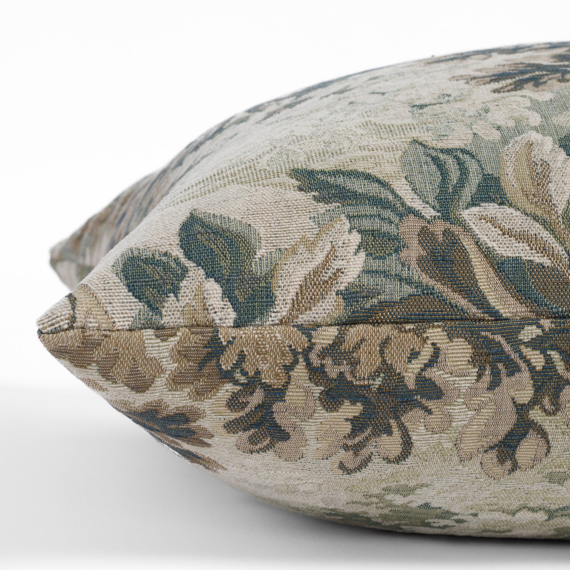 Side angle of Manor Tapestry Sage bed bolster pillow, extra long lumbar cushion in woven botanical tapestry.