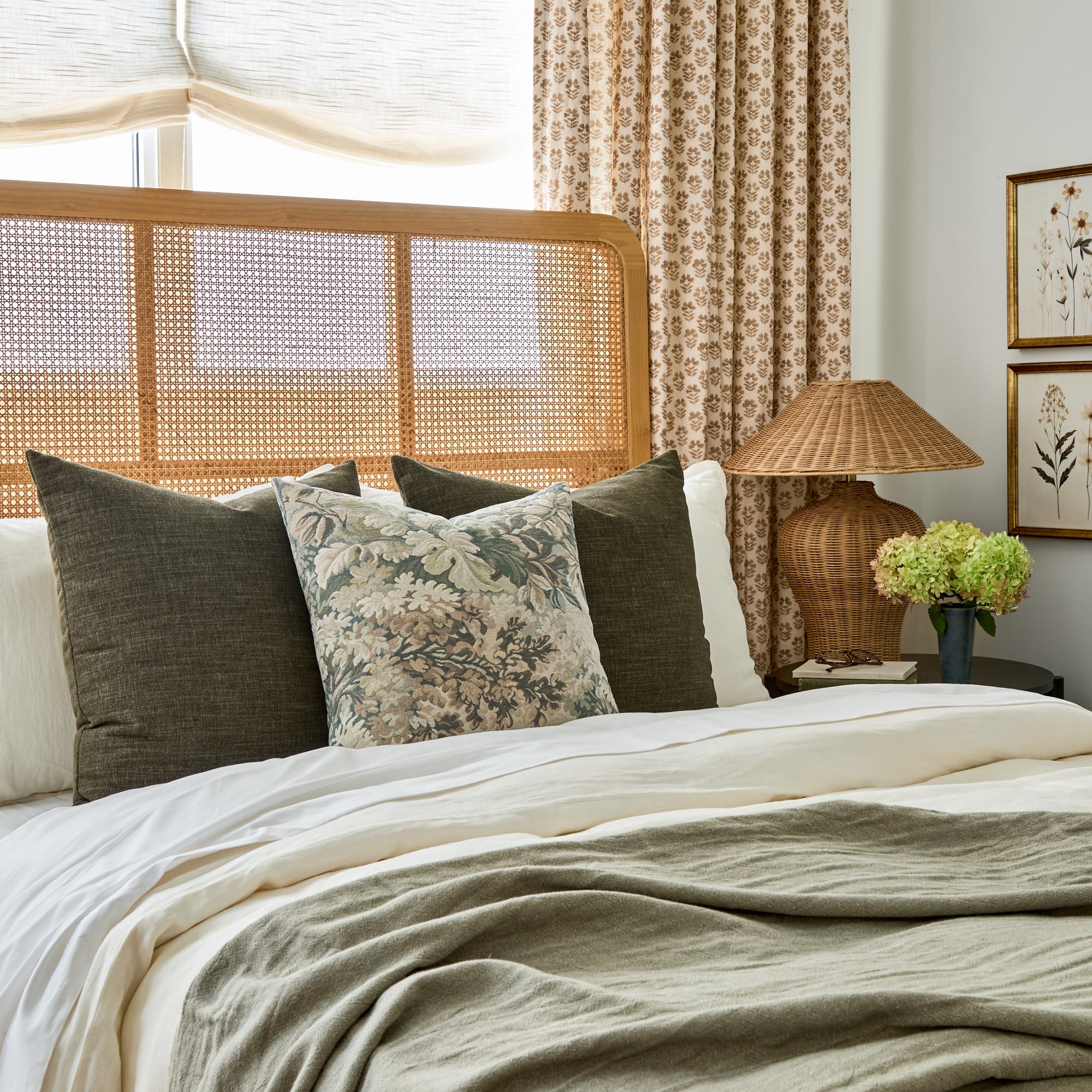 Bedford moss green 22x22 throw pillows styled on bed with Manor Tapestry Sage cushion from Tonic Living.