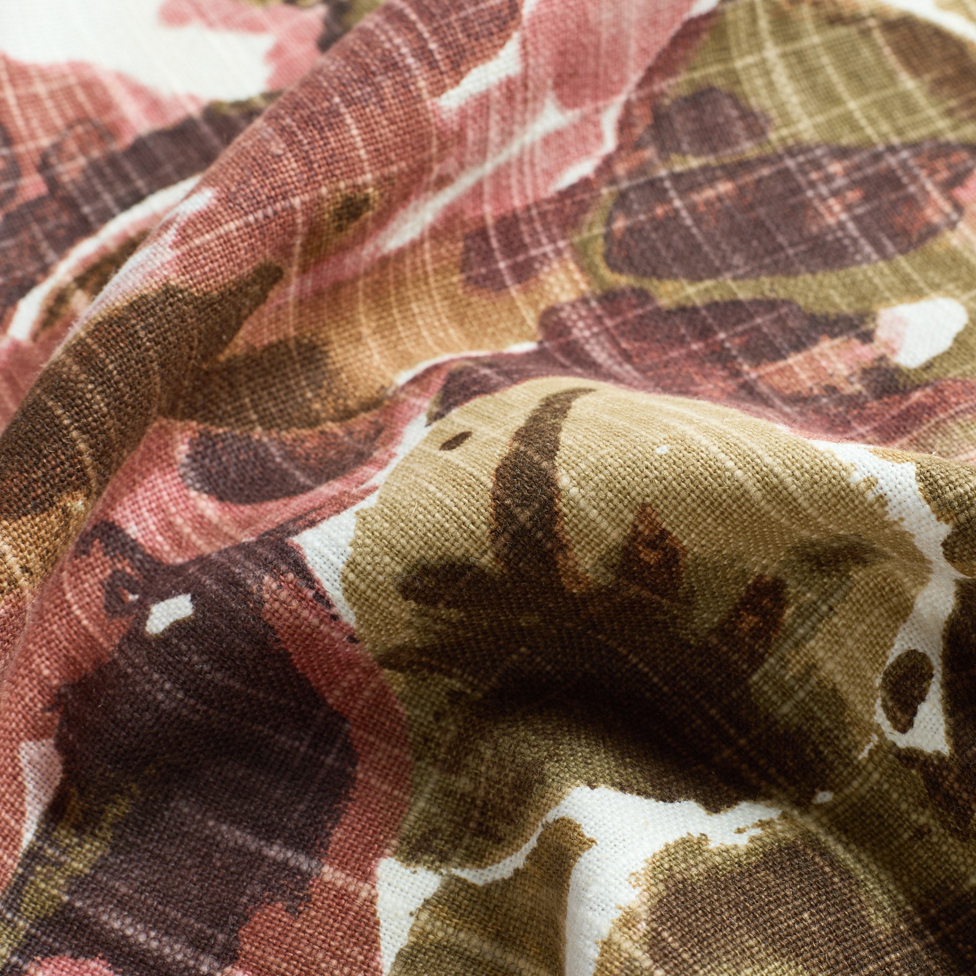 Close up of Tonic Living Marbella Rose fabric showing abstract florals in burgundy, dusty rose, deep brown, olive, khaki, and soft white.