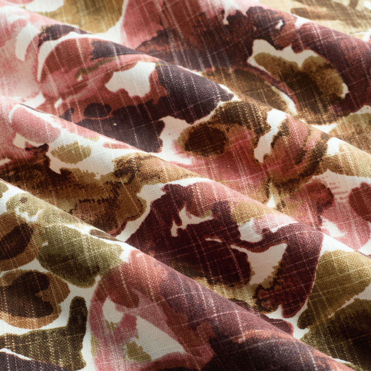 Tonic Living Marbella Fabric in Rose, a painterly floral upholstery and drapery fabric in burgundy and soft pink.