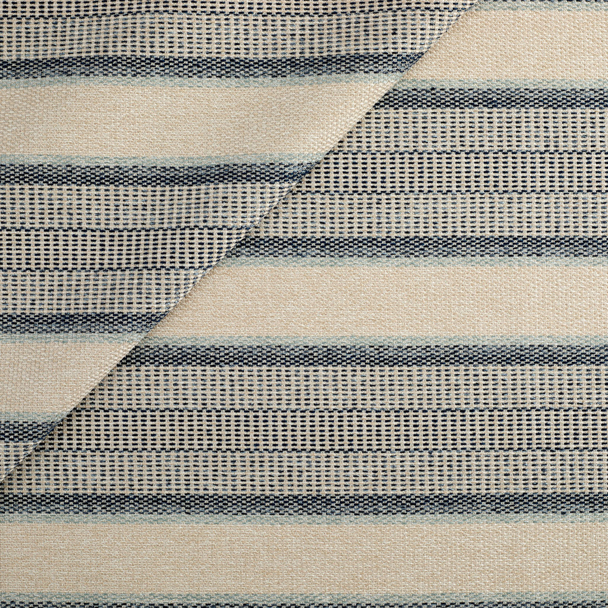 Tonic Living Miller Stripe Fabric in Denim, a faded blue and beige striped high-performance upholstery fabric.