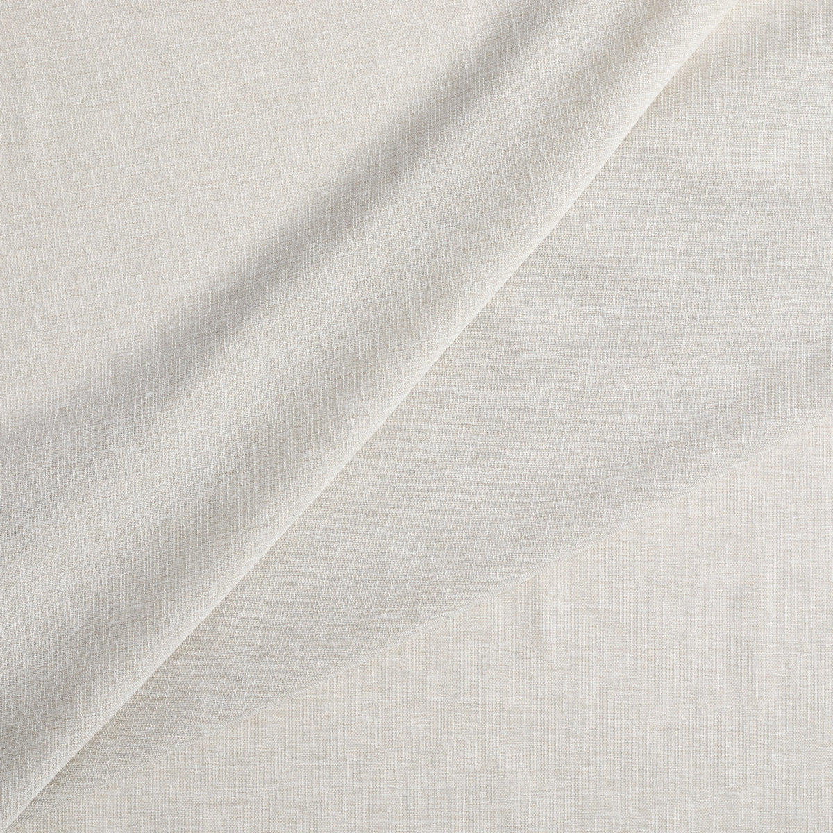 Tonic Living Monaco Sheer Fabric in Fog, a lightweight neutral sheer fabric for curtains and window treatments.