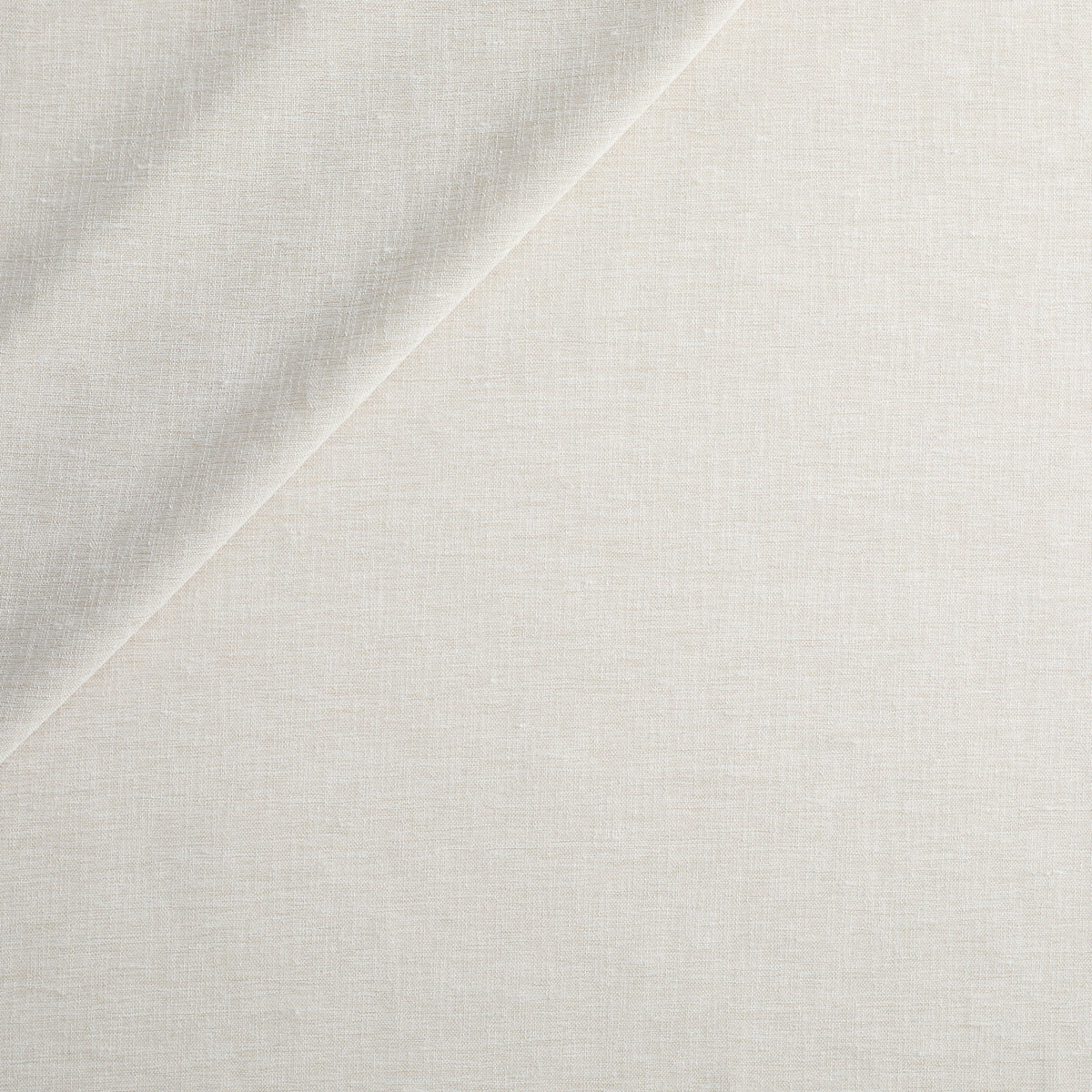 Tonic Living Monaco Sheer Fog drapery fabric featuring a soft beige colour and subtle horizontal slub texture.