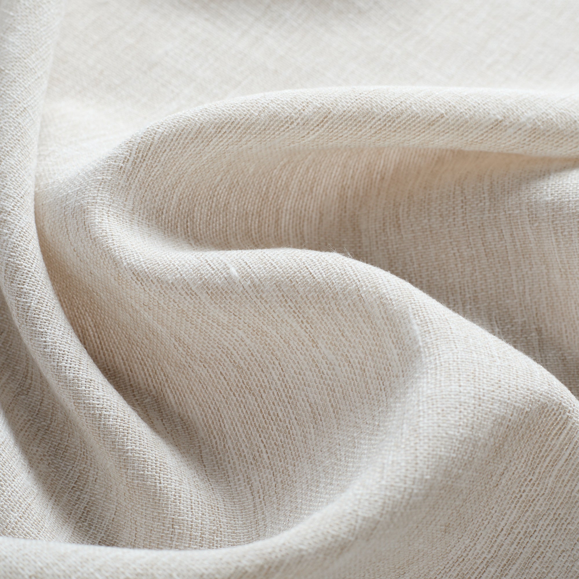 Tonic Living Monaco Sheer Fabric in Fog, a beige sheer curtain fabric with a translucent light-filtering weave.