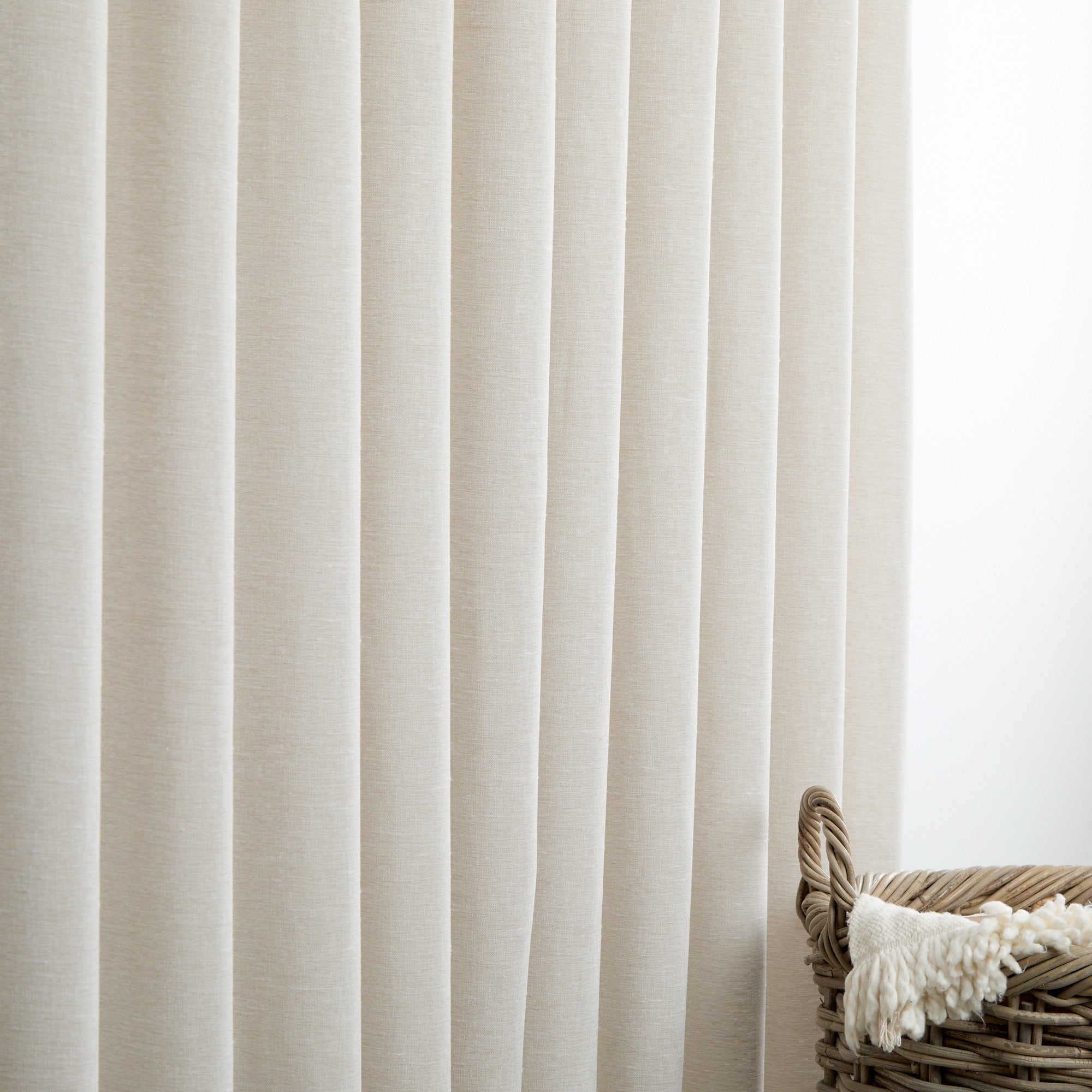 Tonic Living Monaco Sheer Fog shown as soft beige sheer curtains that gently filter natural light.