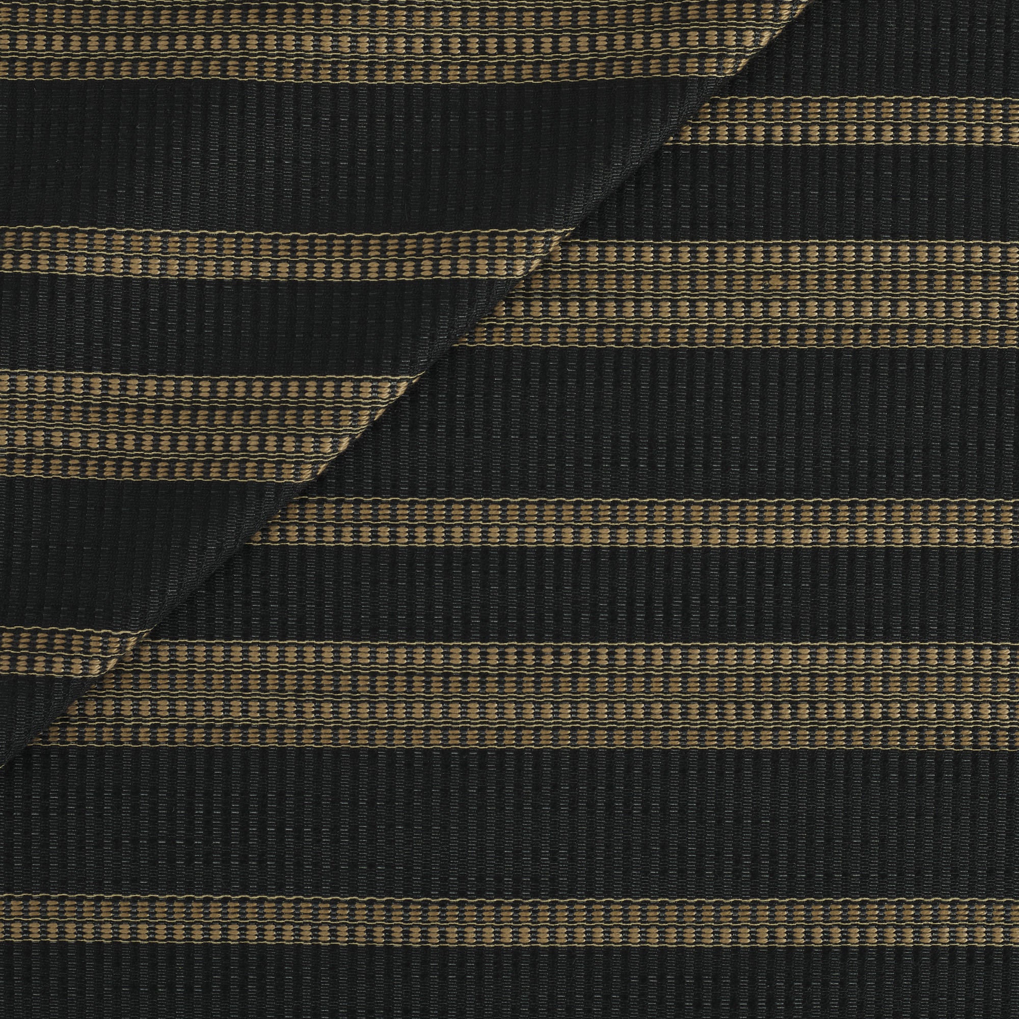 Tonic Living Odessa InsideOut Fabric in Carbon, a black and tan indoor/outdoor upholstery fabric with bold vertical stripes.