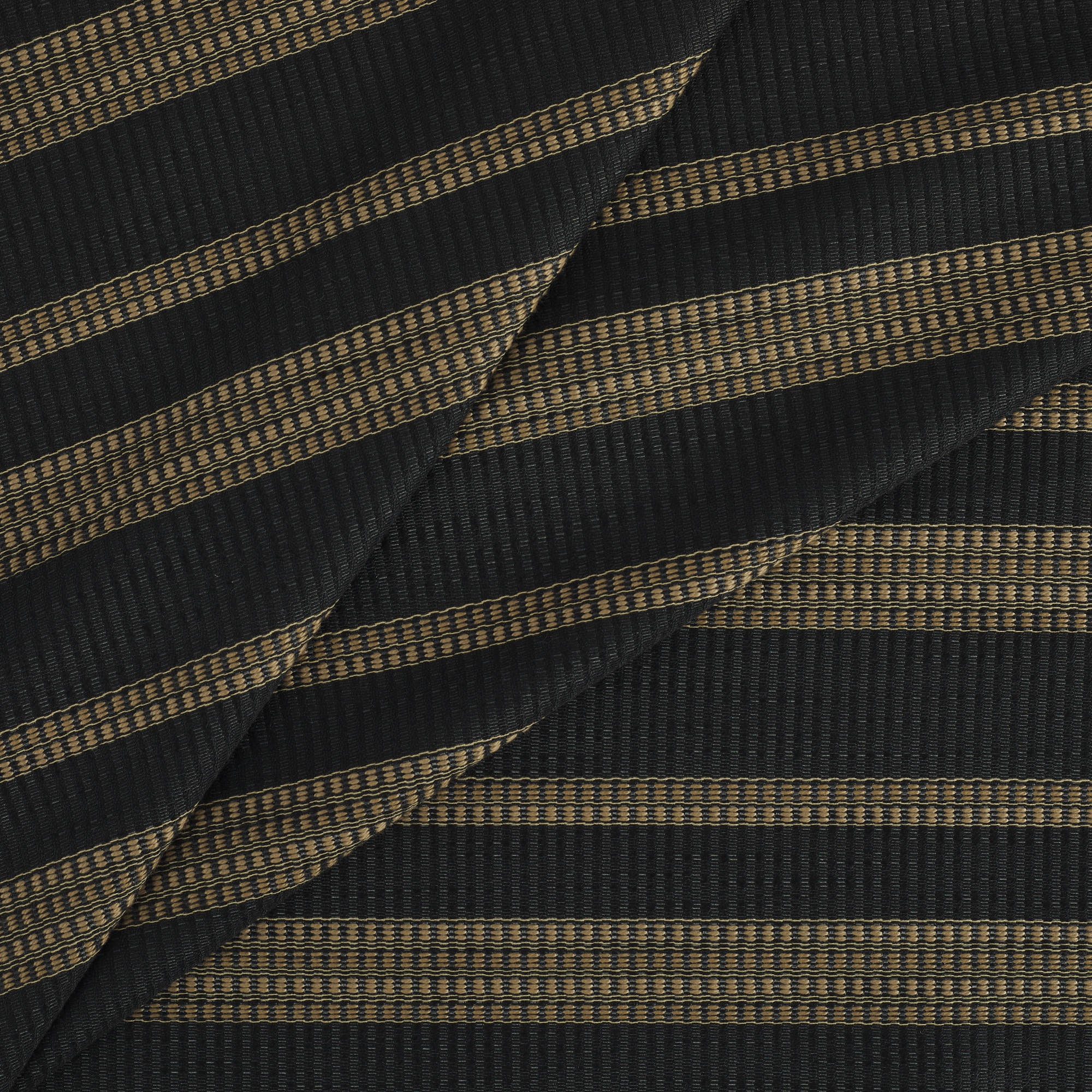 Tonic Living Odessa InsideOut Carbon indoor/outdoor upholstery fabric with a striking striped design in neutral tones.