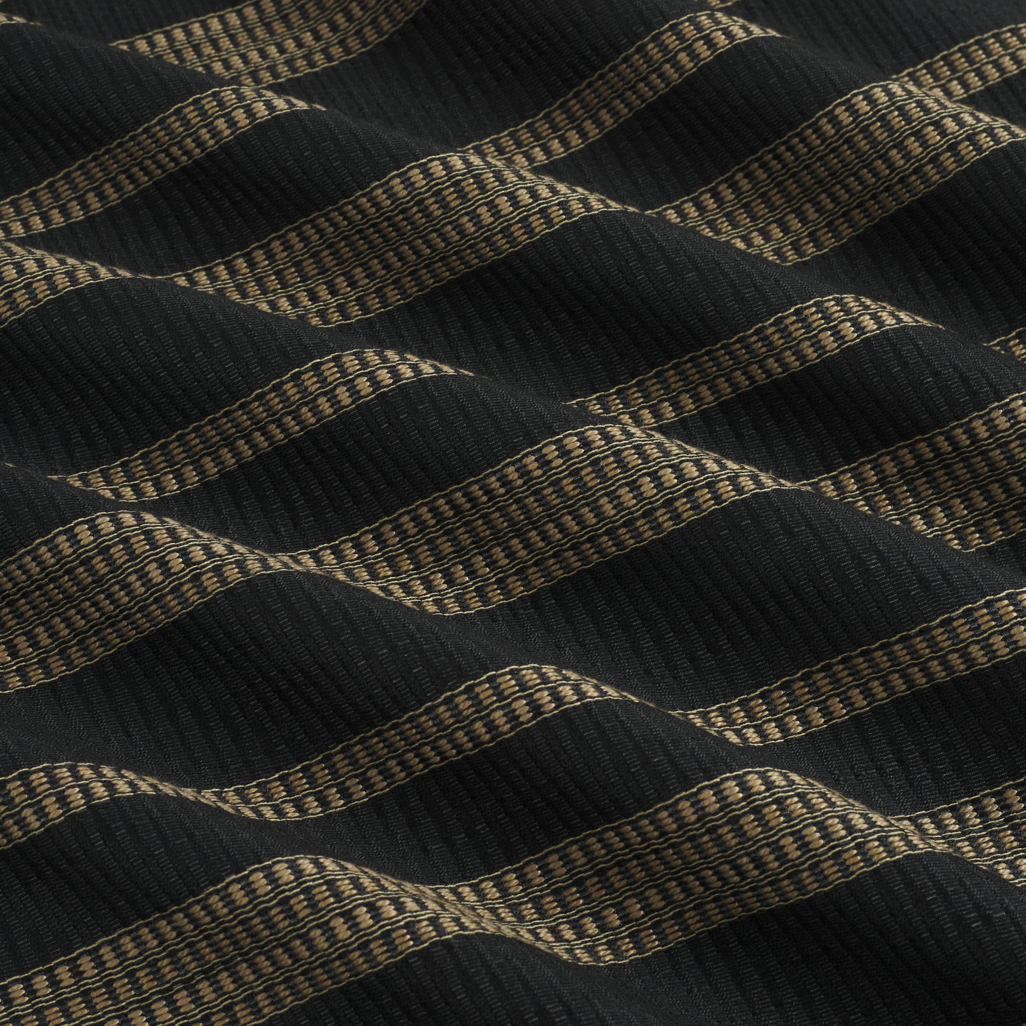 Tonic Living Odessa InsideOut Carbon performance fabric featuring a bold black and tan vertical stripe.