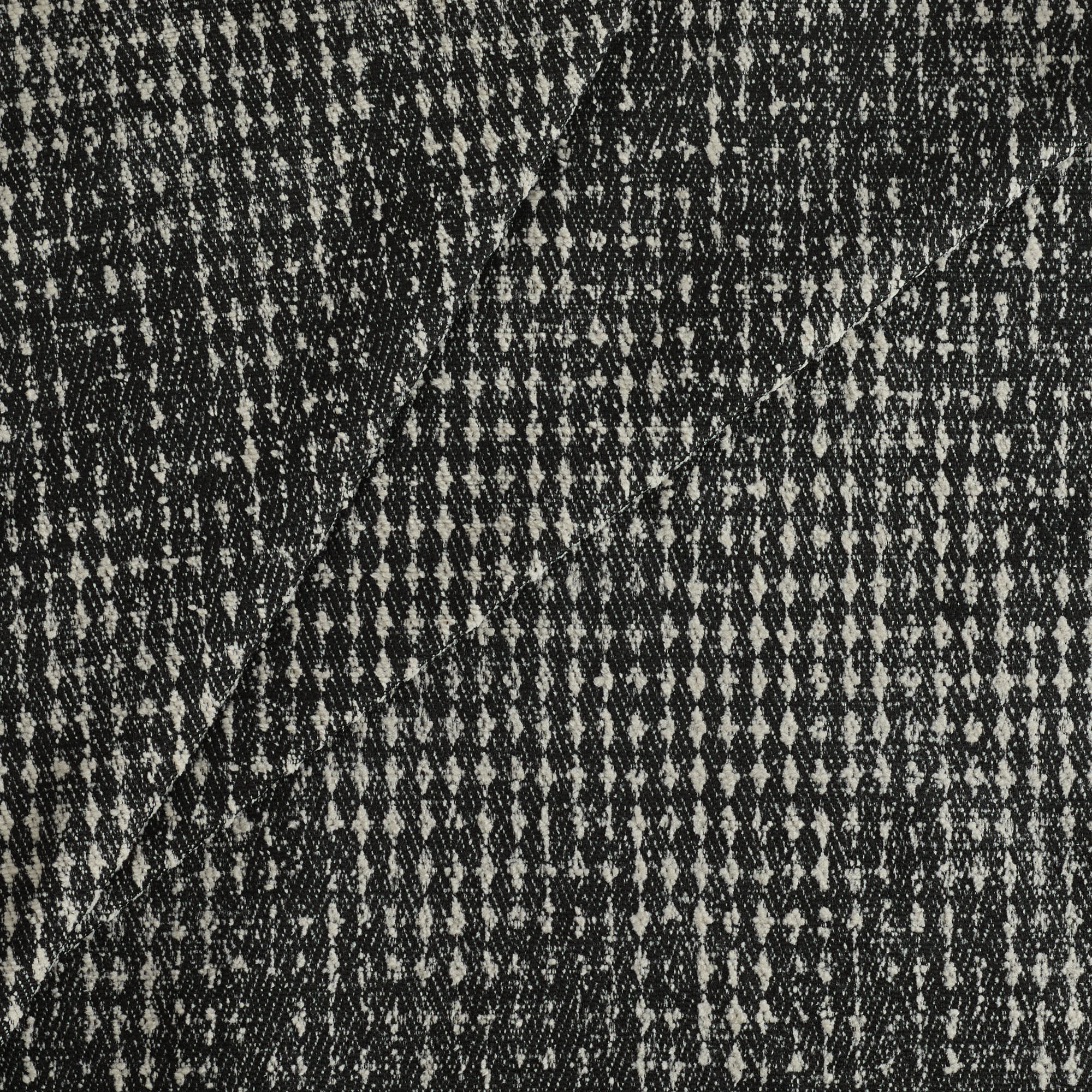 Tonic Living Otto Fabric, Domino — contemporary black and soft-white upholstery fabric with a textured, graphic pattern.