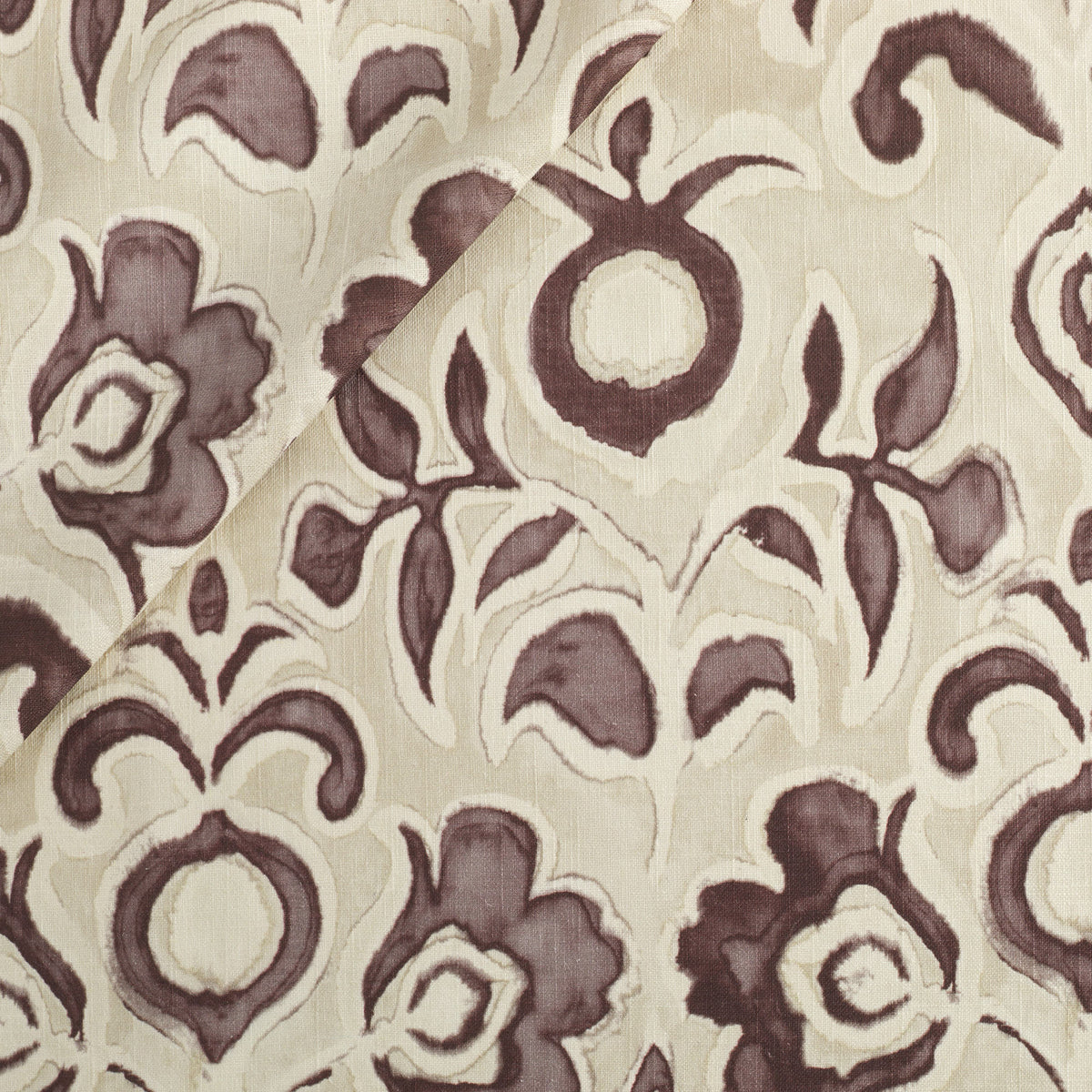 Tonic Living Paloma Fabric in Mauve, a muted purple floral drapery fabric with bold blooms and scrolling leaves on an oatmeal beige ground.