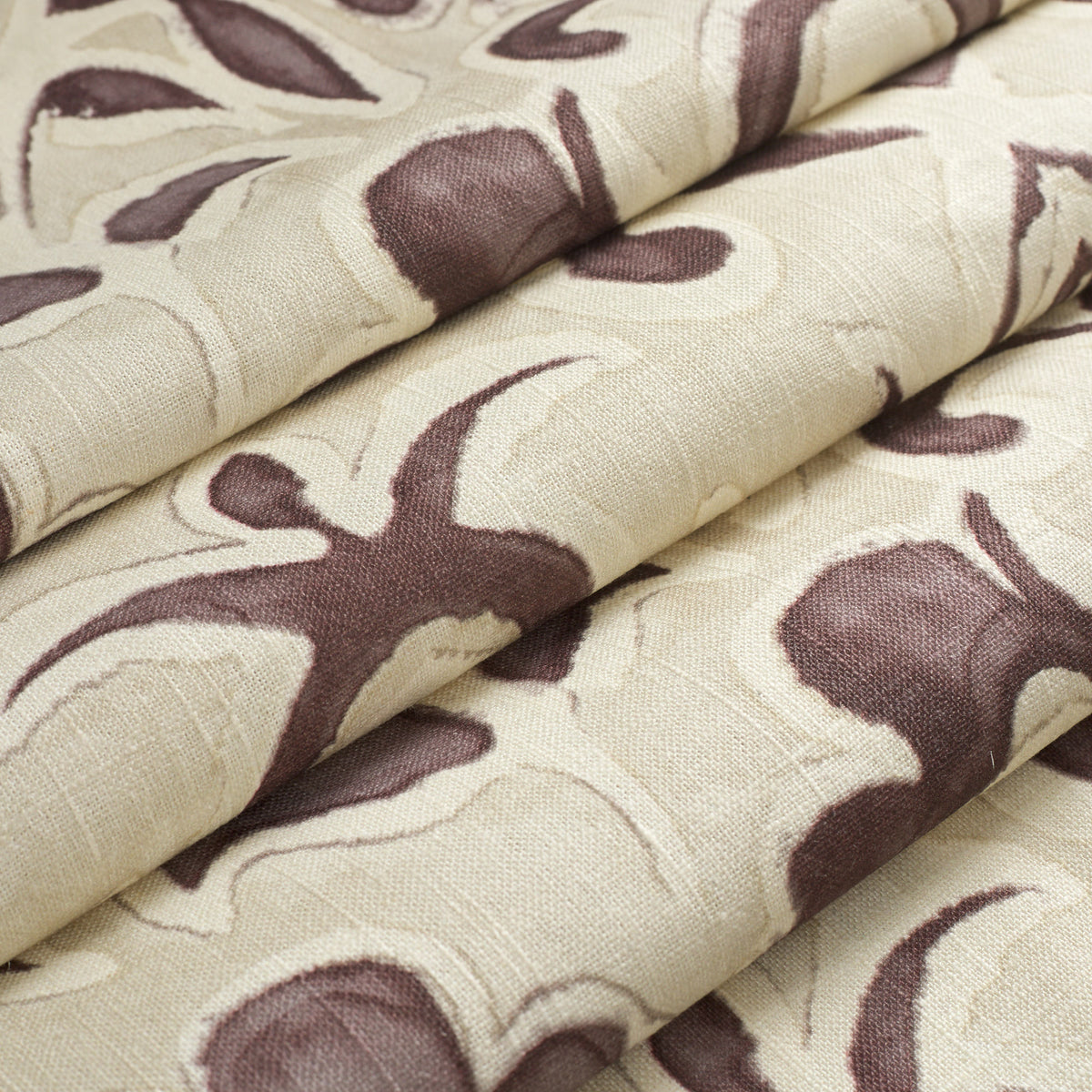Tonic Living Paloma Mauve floral fabric shown as a Roman shade, featuring a stylized smoky plum botanical pattern on oatmeal beige.