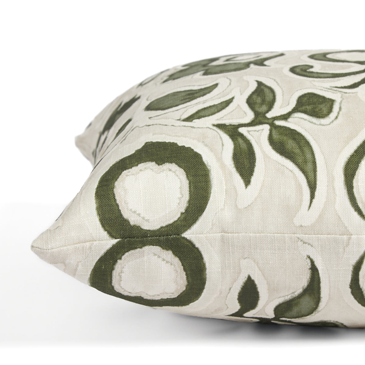 Side view of Tonic Living Paloma Olive toss cushion highlighting its stylized green floral pattern and soft neutral palette.