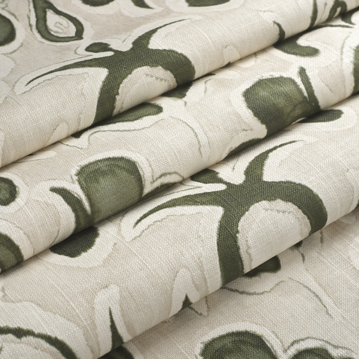 Tonic Living Paloma Olive floral fabric shown as a Roman shade, featuring a stylized olive green botanical pattern on oatmeal beige.