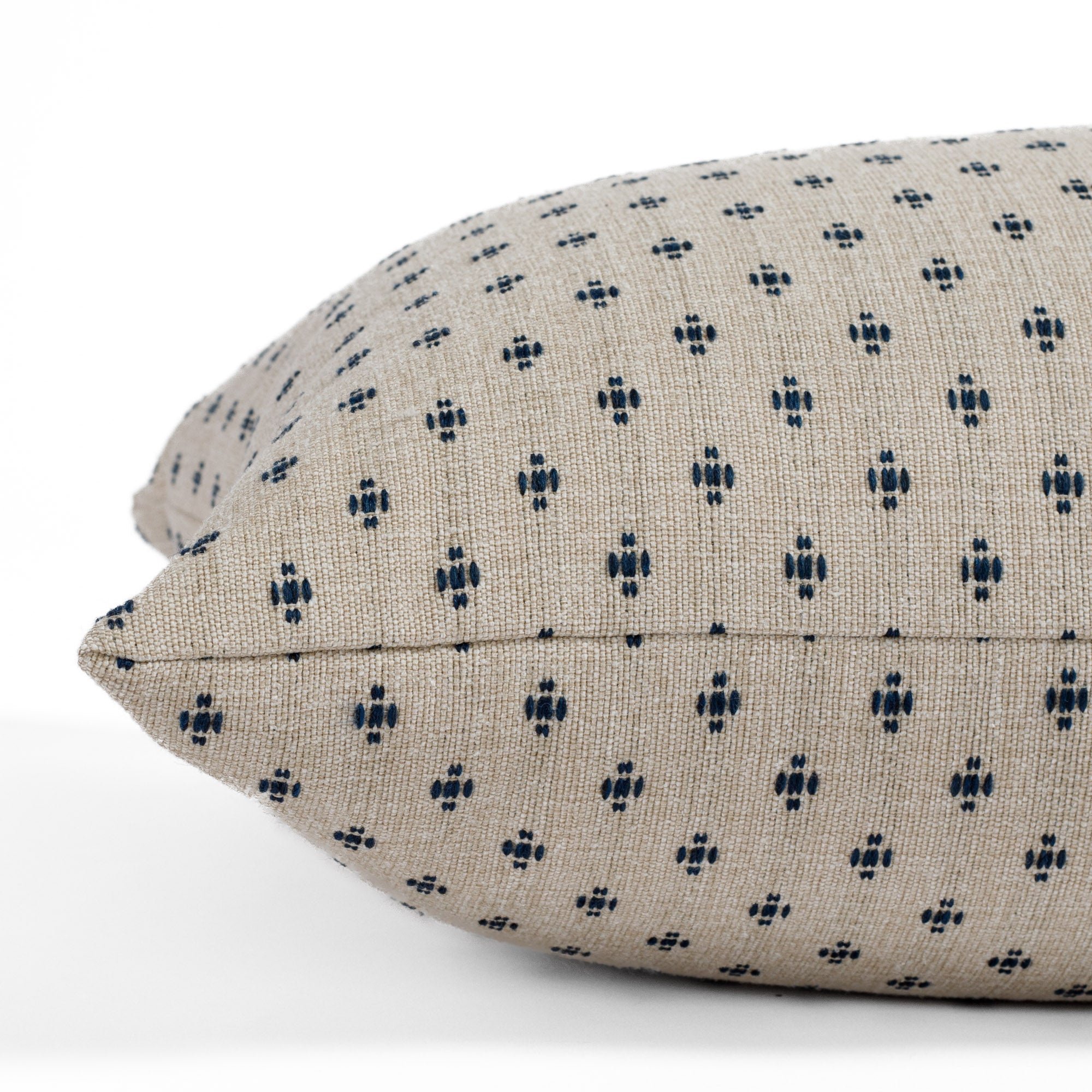 Pierce 16x42 Bolster Pillow, a taupe and dark blue dotted pillow from Tonic Living: close up side view.