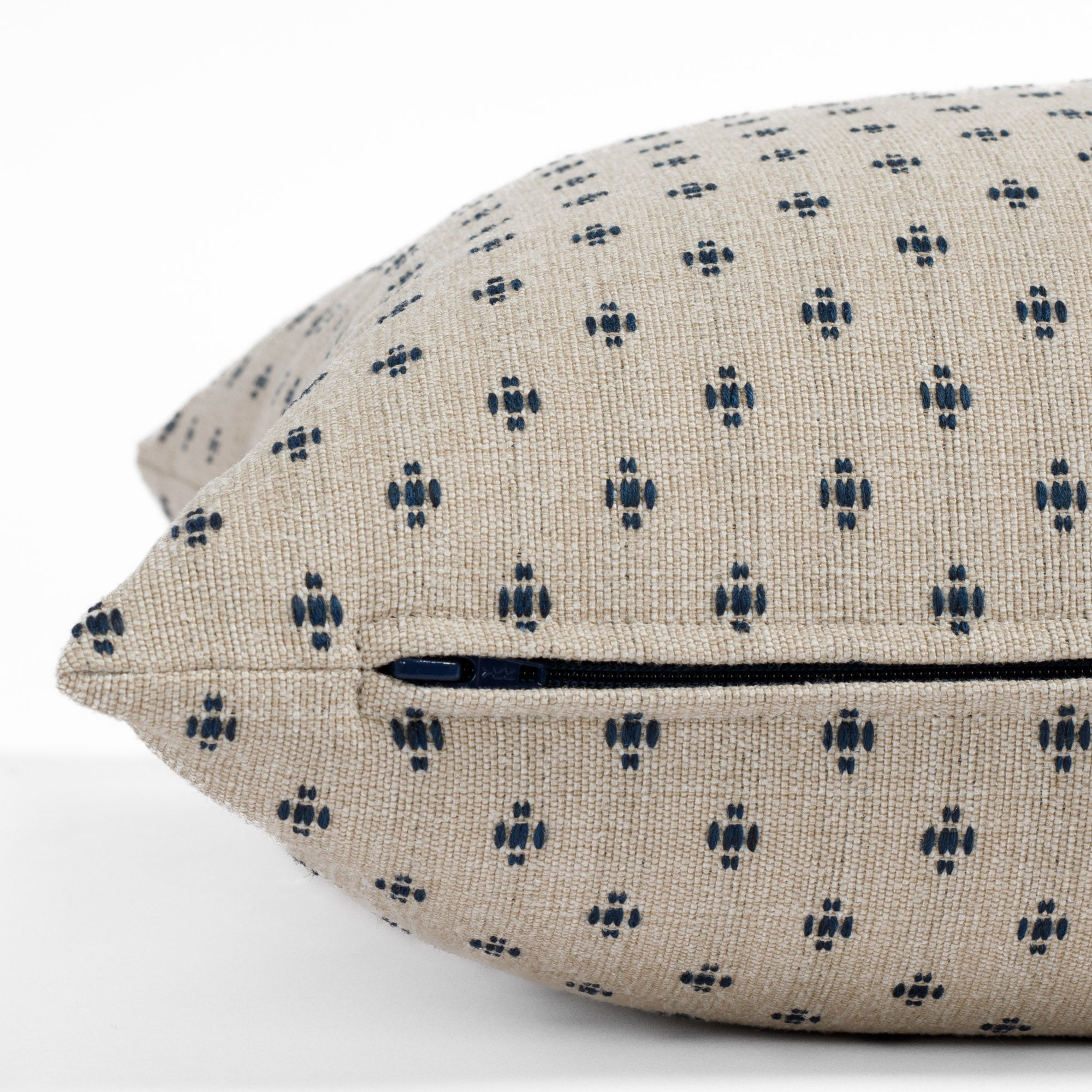 Pierce Navy, a textured traditional pillow from Tonic Living: close up zipper view.