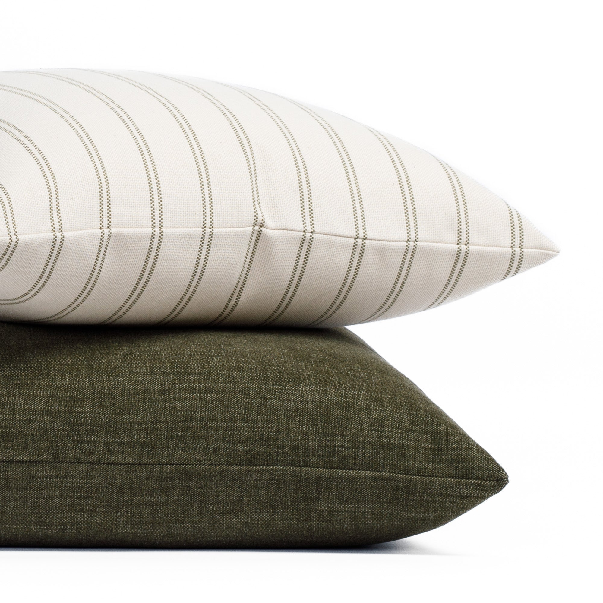 Stacked pillows: Tonic Living Rexton Stripe Moss 20x20 and Bedford 22x22 Moss decorative pillows in green tones.