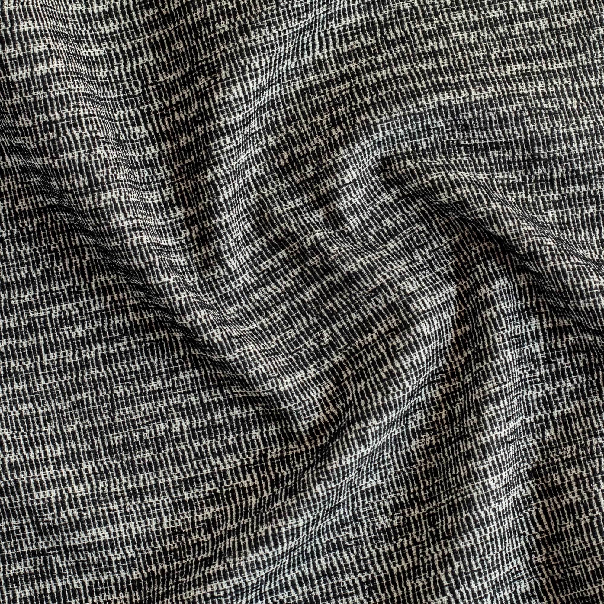 a black and off-white textured patterned Tonic Living fabric