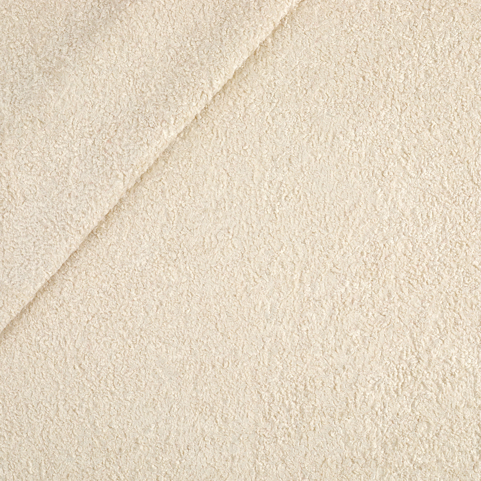 Tonic Living Rupert Parchment multi-use upholstery fabric featuring a soft cream bouclé texture.