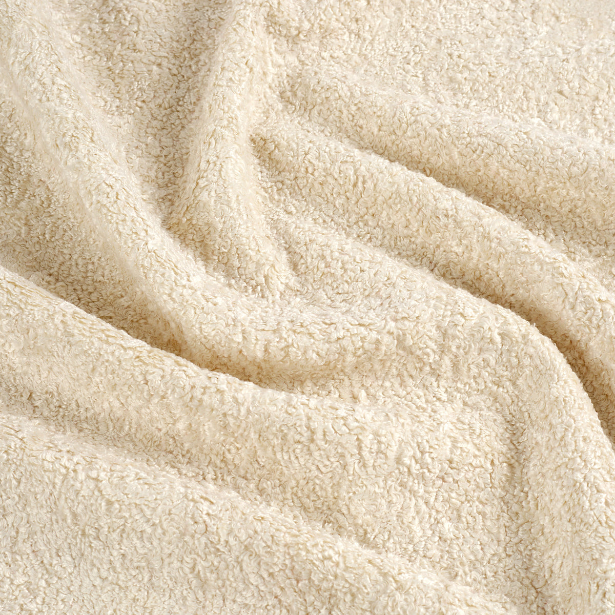 Tonic Living Rupert Fabric in Parchment, a creamy off-white bouclé upholstery fabric with cozy woven texture.