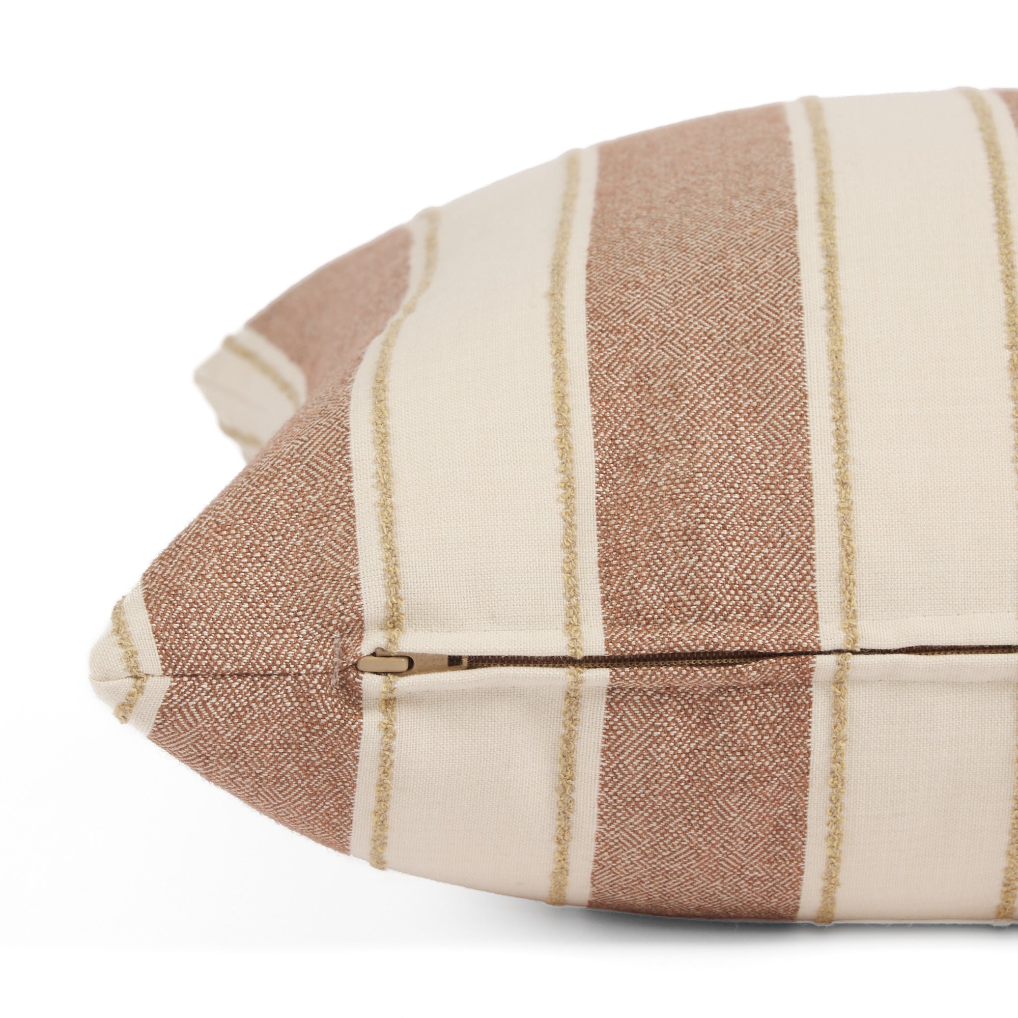 Side zipper detail of Tonic Living Sentiment 20x20 outdoor toss pillow in terracotta stripe.