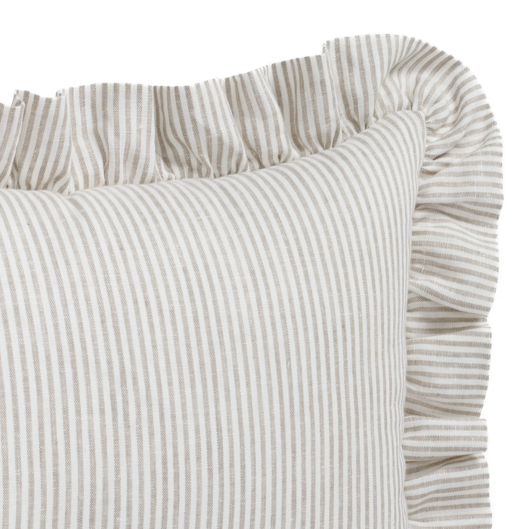 Detail shot of Tonic Living’s Siena decorative ruffle lumbar pillow, highlighting the soft neutral tones and romantic ruffle edge in a warm beige and ivory palette.