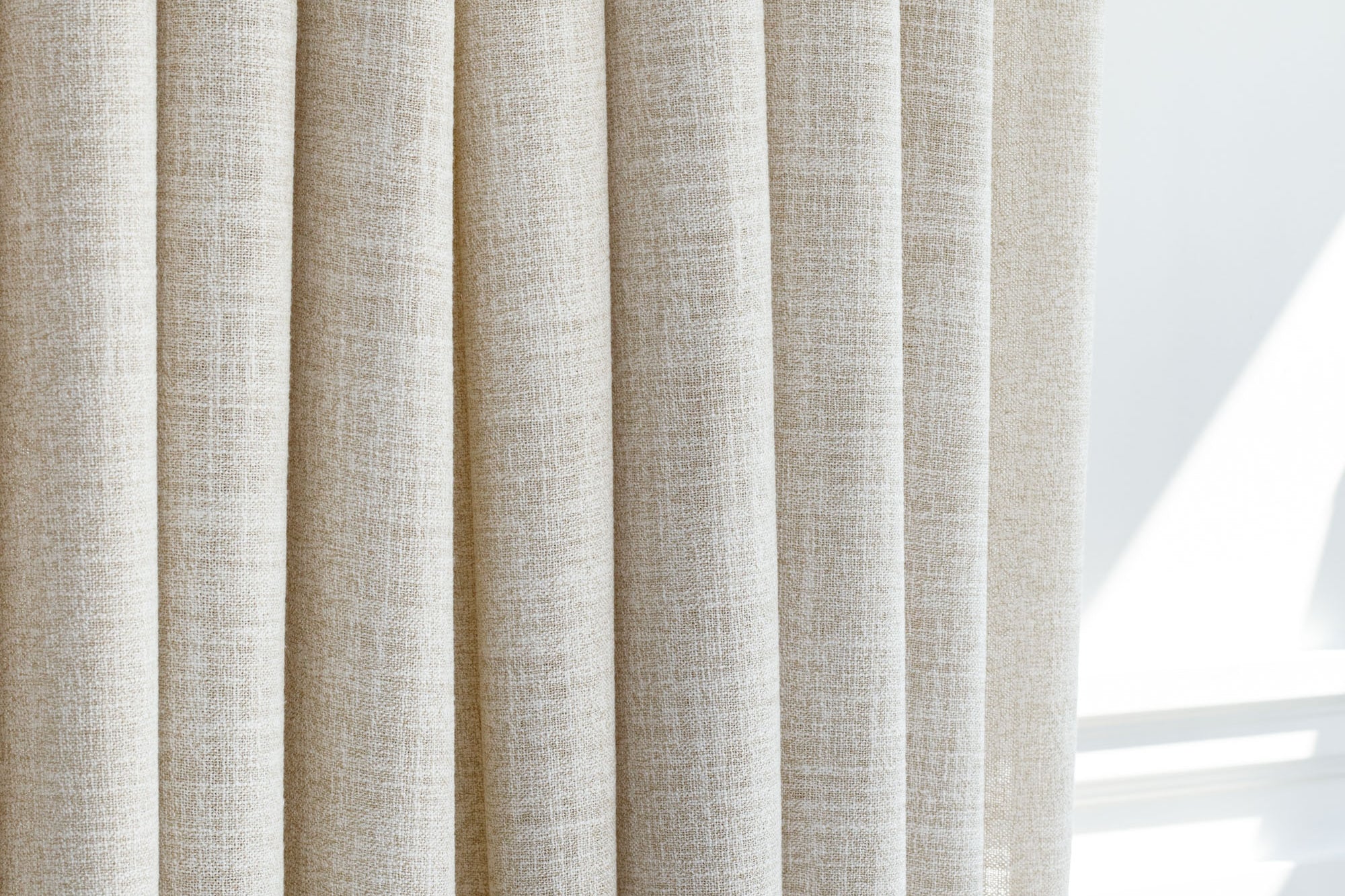 a semi sheer wheat toned double width drapery fabric from Tonic Living