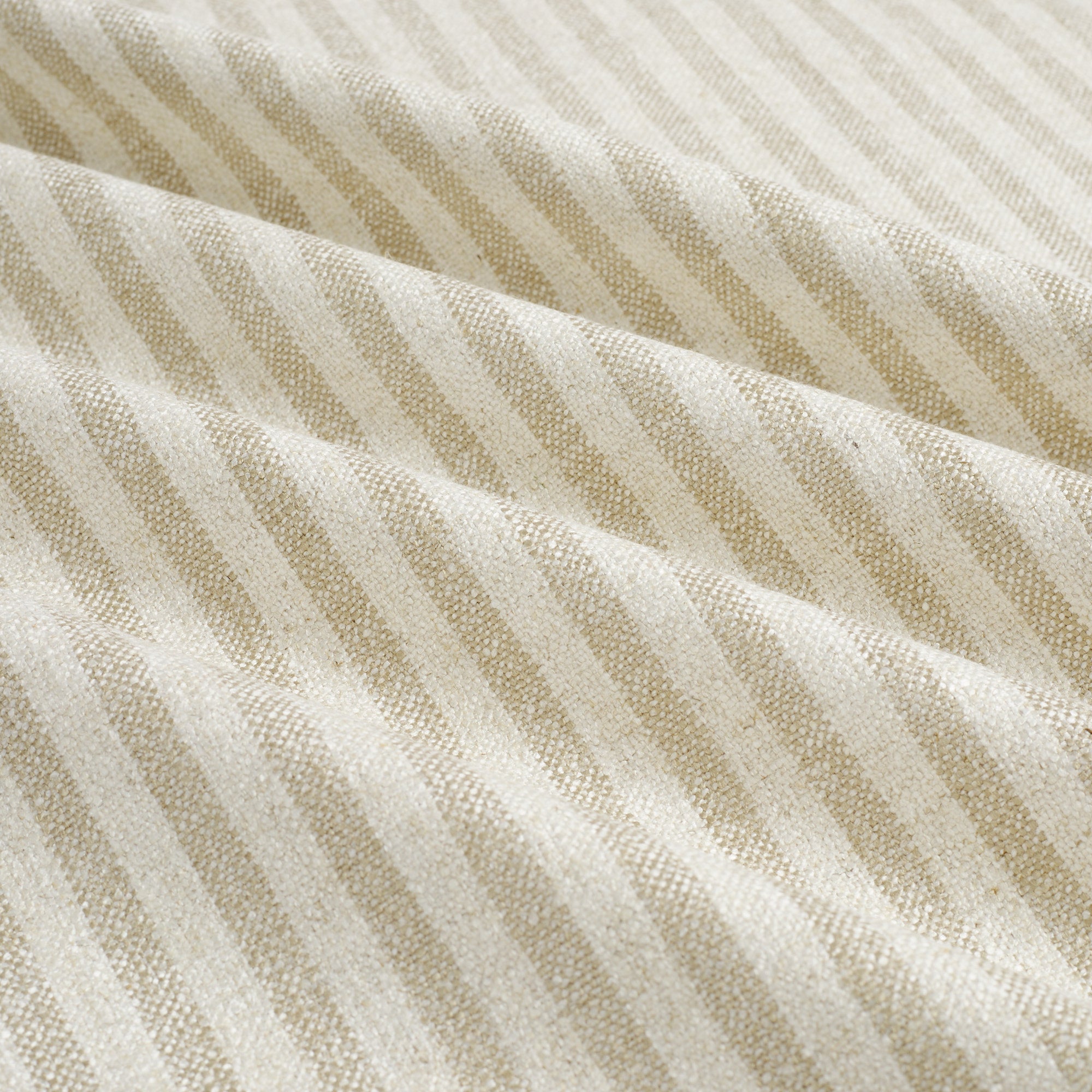 Tonic Living Somerset Stripe Oatmeal fabric featuring a timeless light oatmeal and beige vertical stripe pattern.