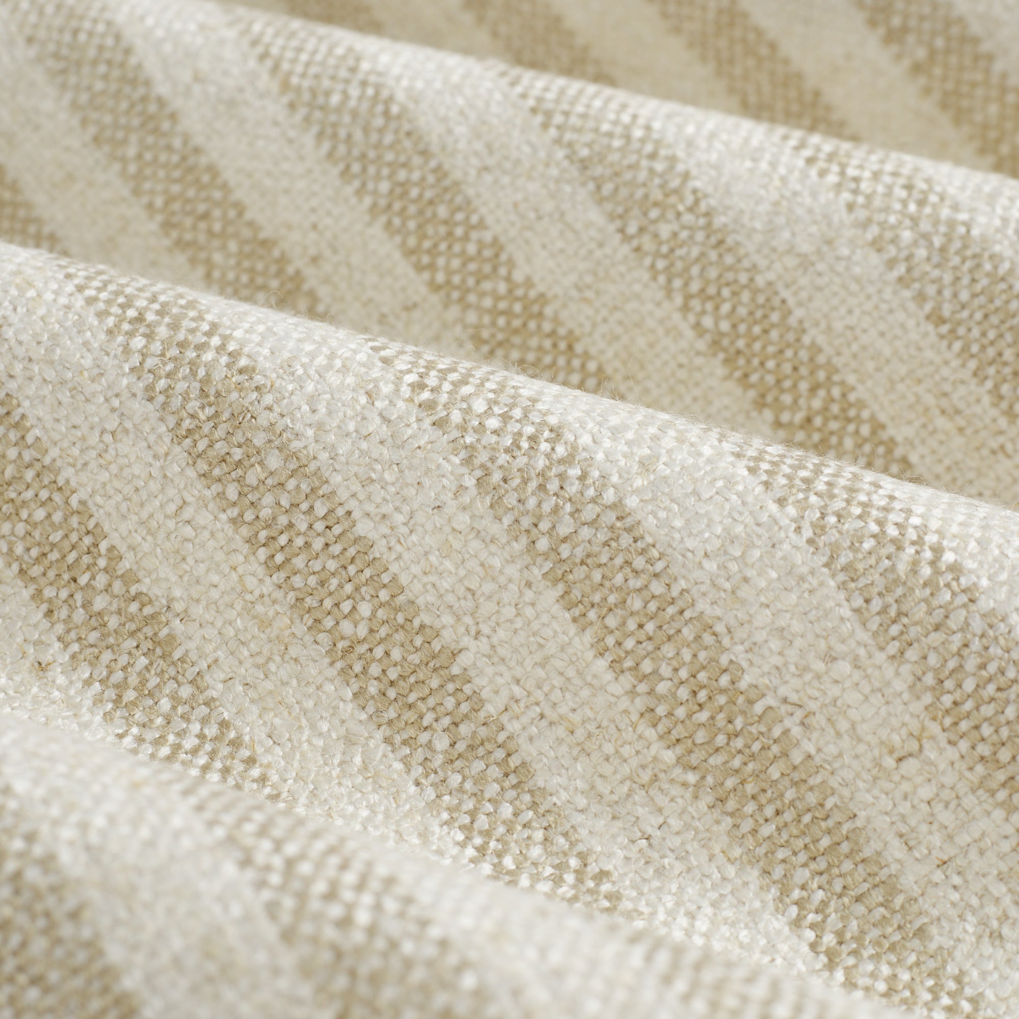 Close up of Tonic Living Somerset Stripe Oatmeal fabric showing light oatmeal and beige vertical stripe detail.
