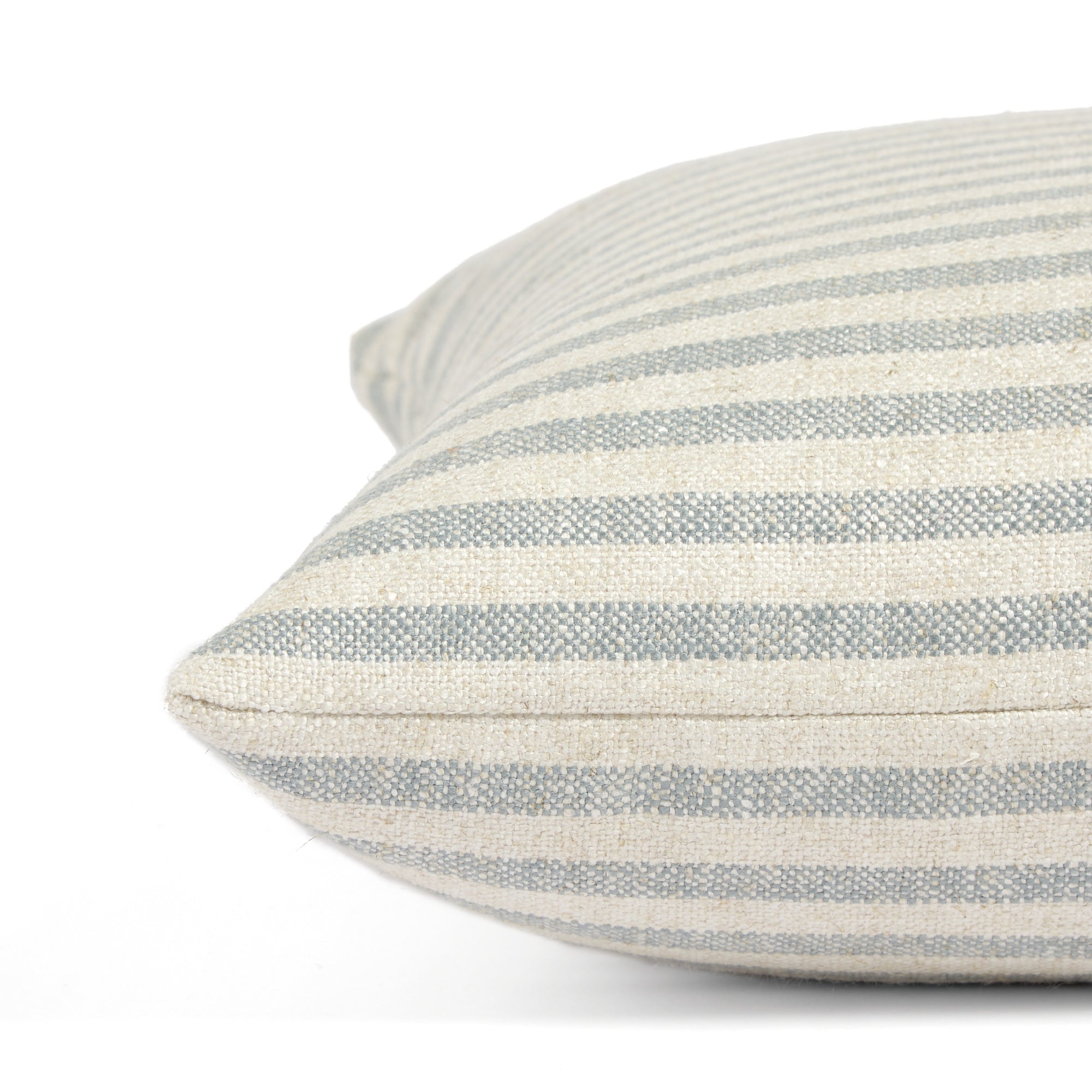 Side view of Tonic Living Somerset Stripe decorative pillow highlighting its classic blue and oatmeal stripe.