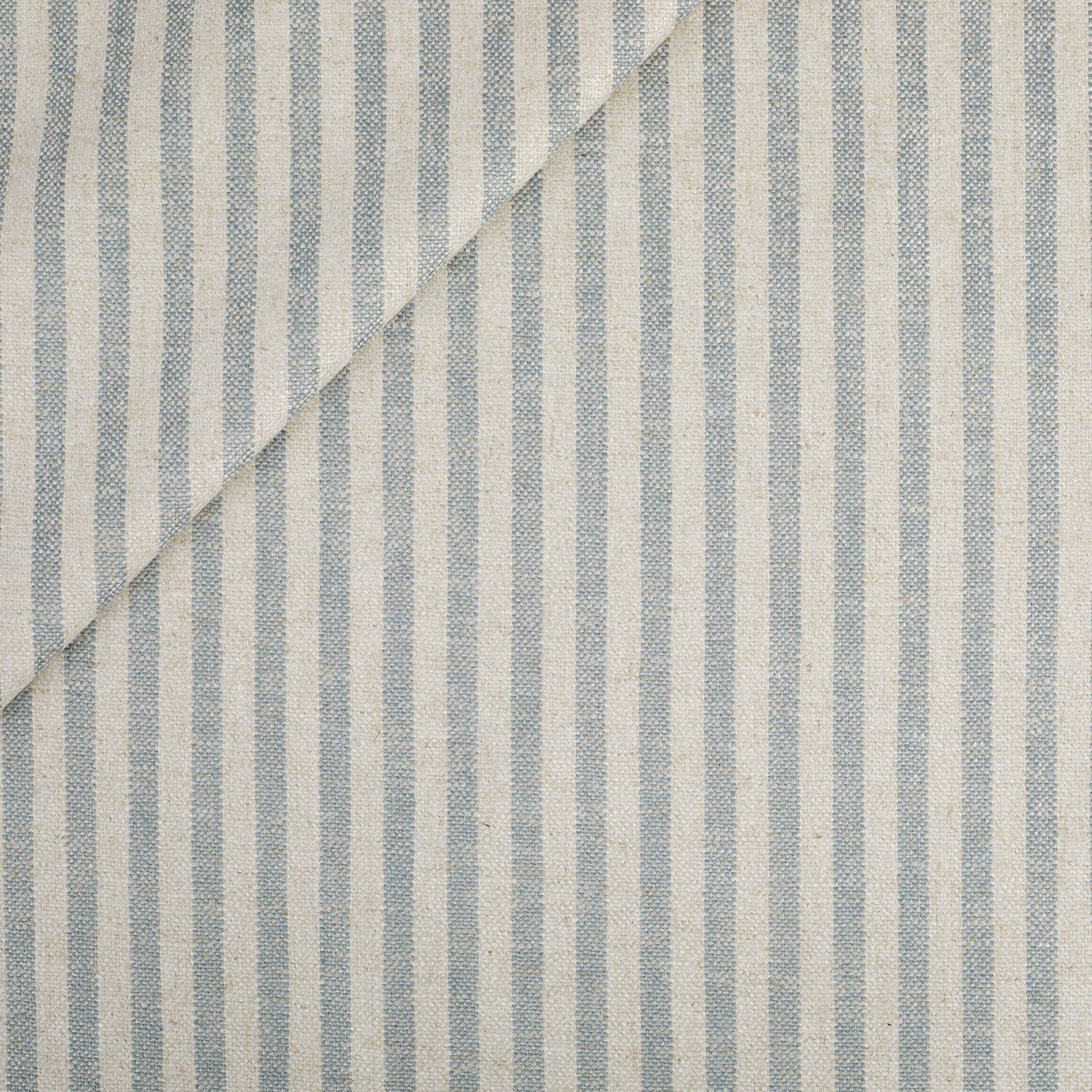 Tonic Living Somerset Stripe Fabric in Sky Blue, a light blue and beige upholstery fabric with vertical stripe.