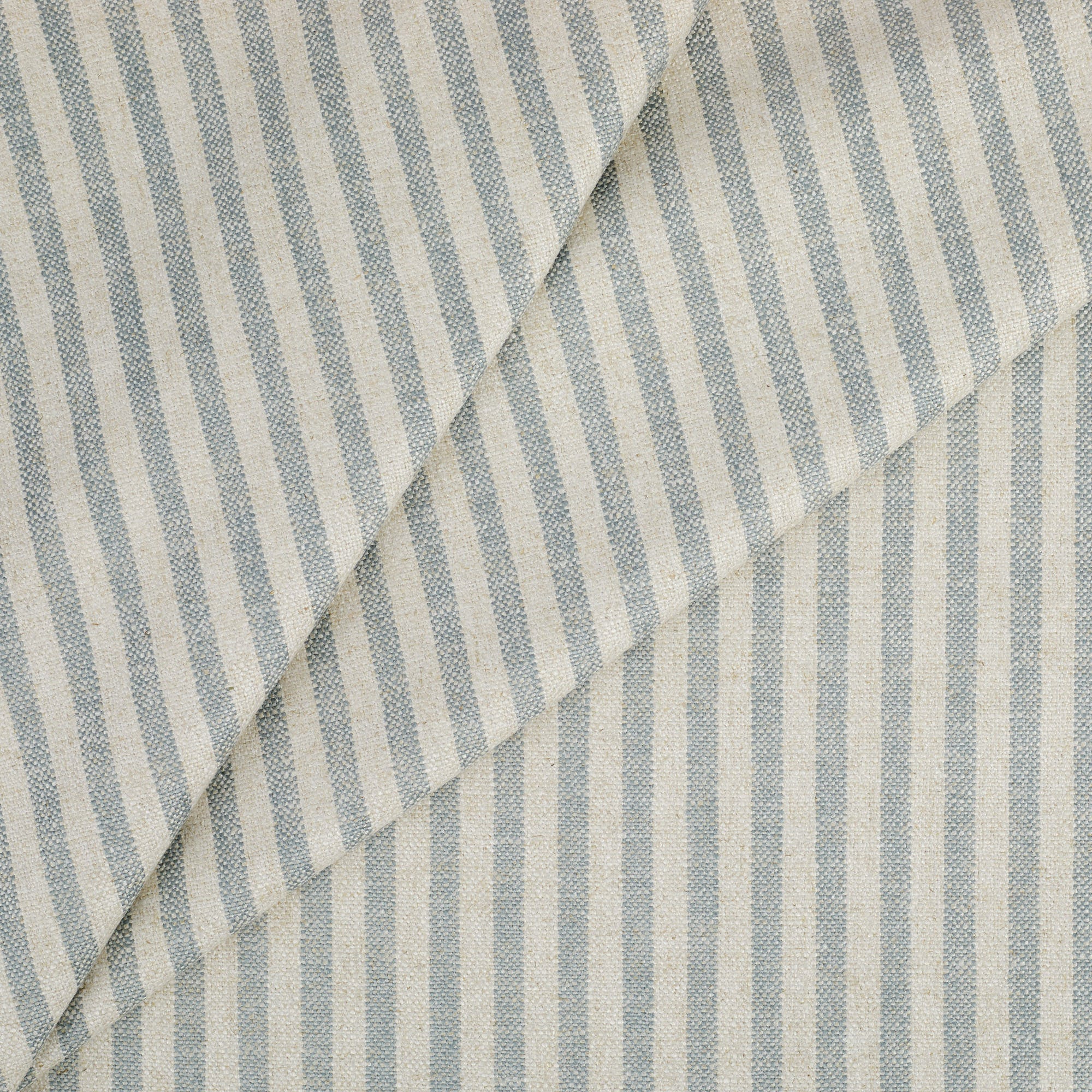 Tonic Living Somerset Stripe Sky Blue upholstery fabric featuring a classic blue and beige striped design.
