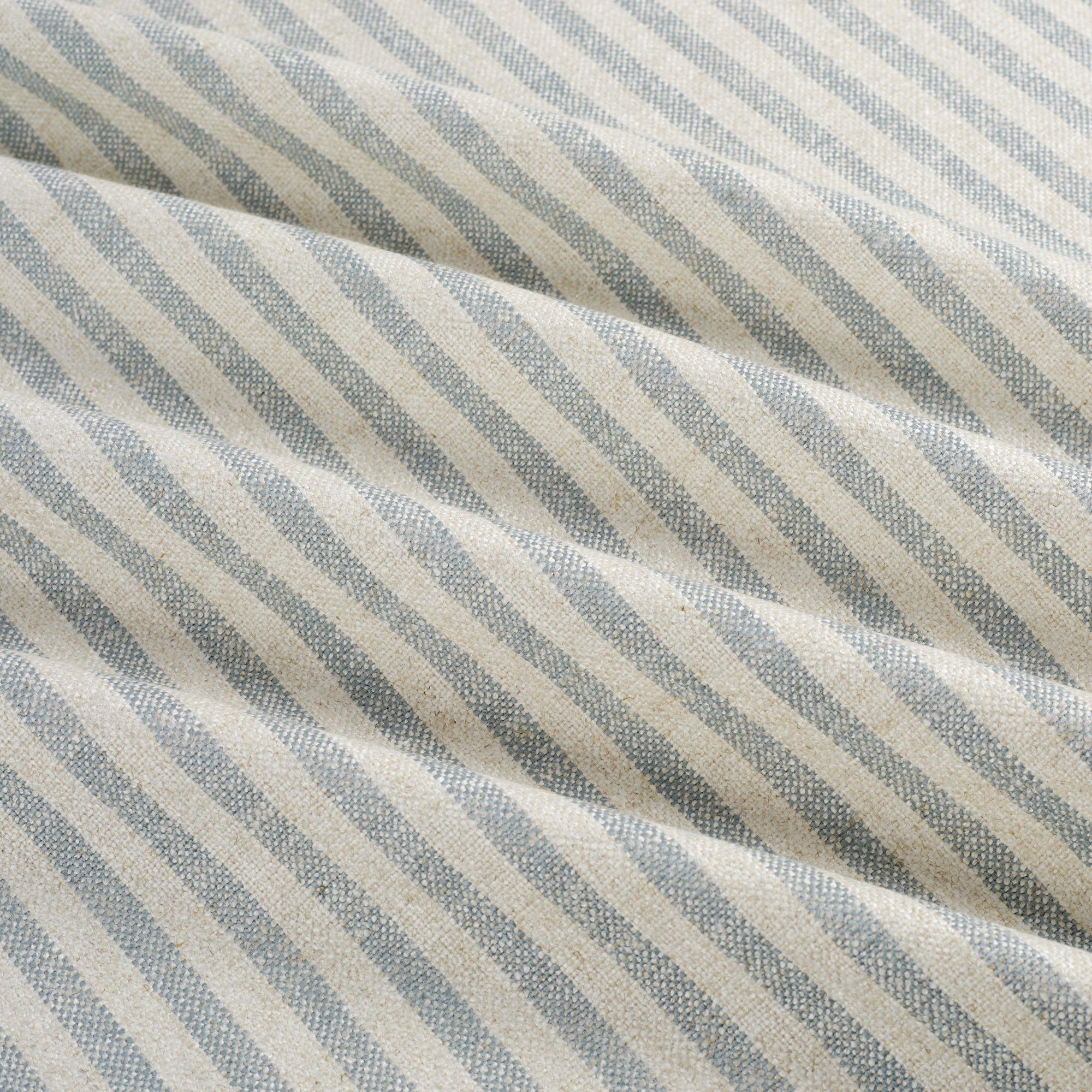 Tonic Living Somerset Stripe Sky Blue fabric shown with soft movement highlighting light blue vertical stripe.