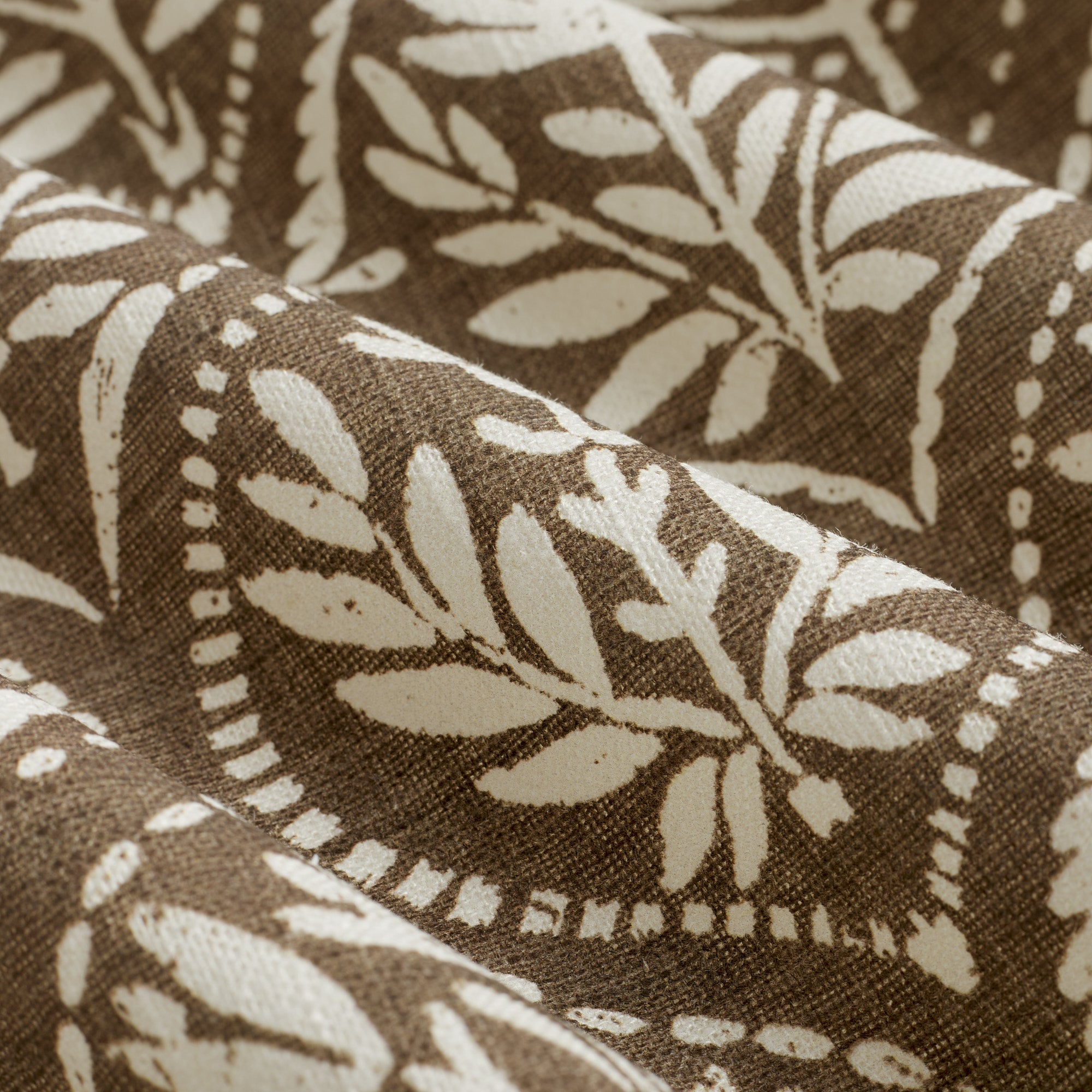 Close up of Tonic Living Stella Mocha fabric showing mocha brown and natural block print medallion detail.
