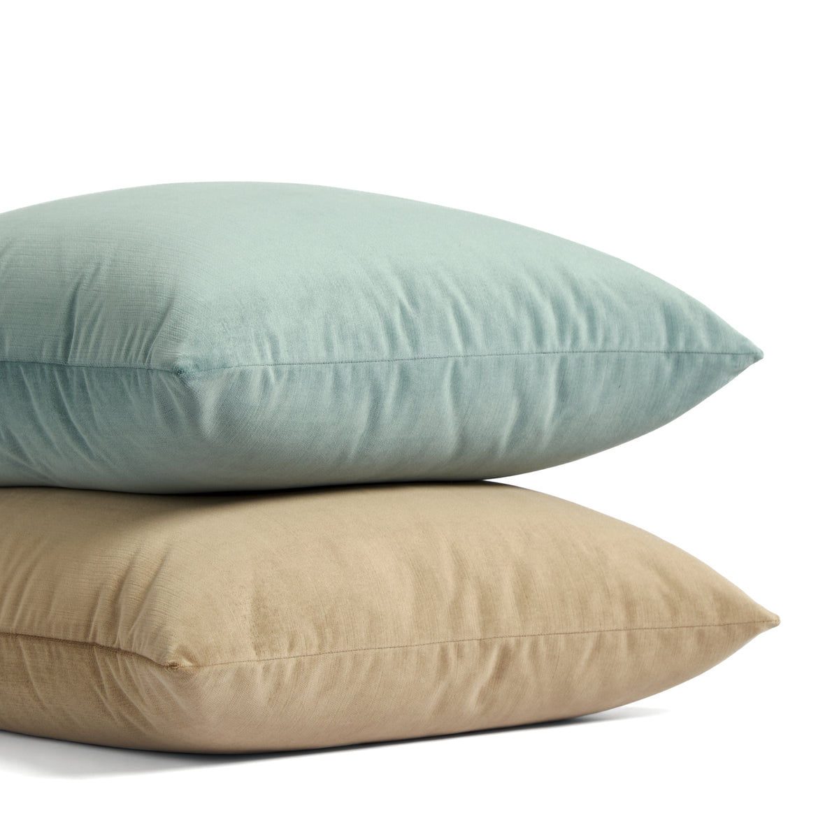 Stack of Tonic Living Sterling Velvet pillows in Lake aqua blue and Bark warm brown velvet.