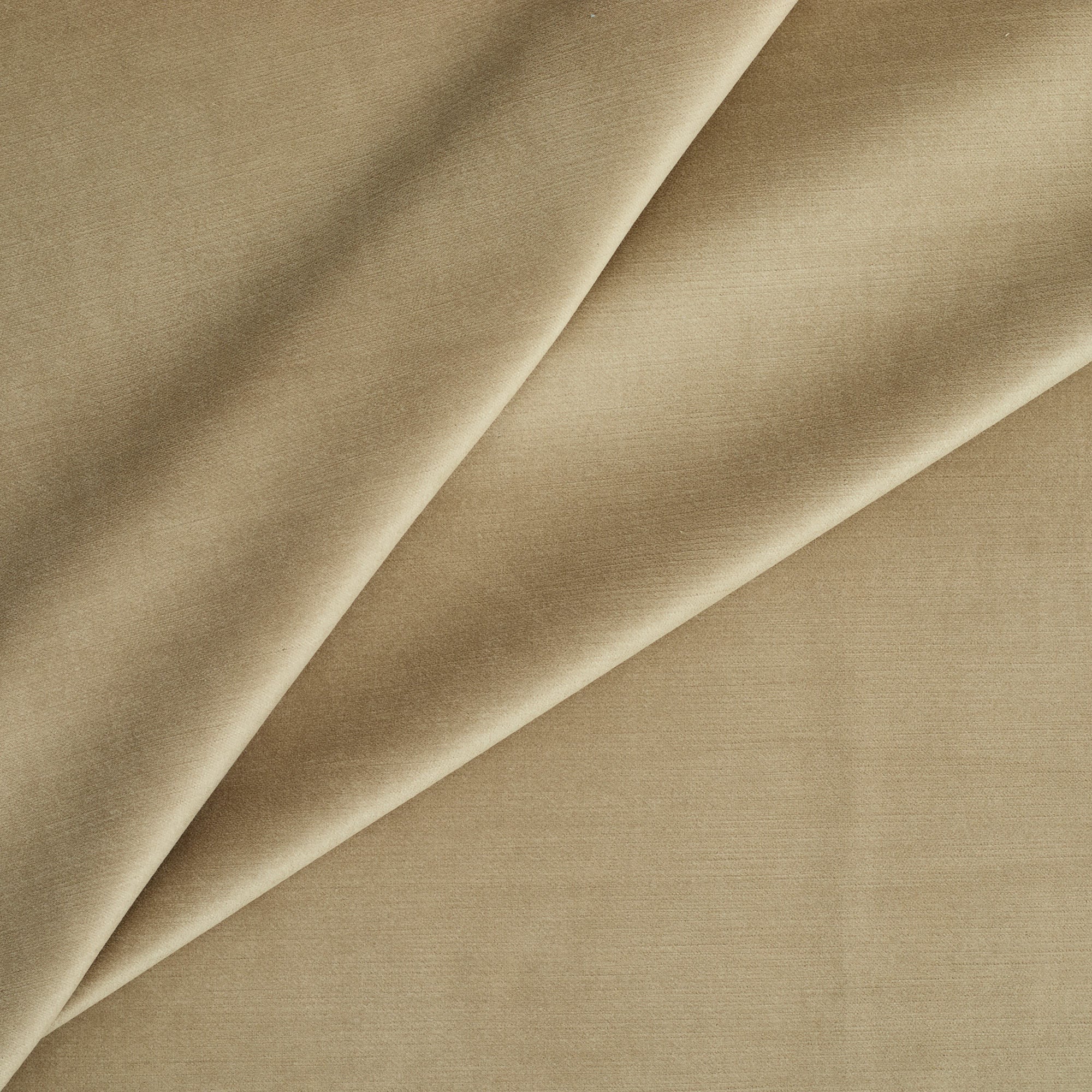 Tonic Living Sterling Velvet Bark upholstery fabric featuring warm light brown and golden tan tones with a refined velvet texture.