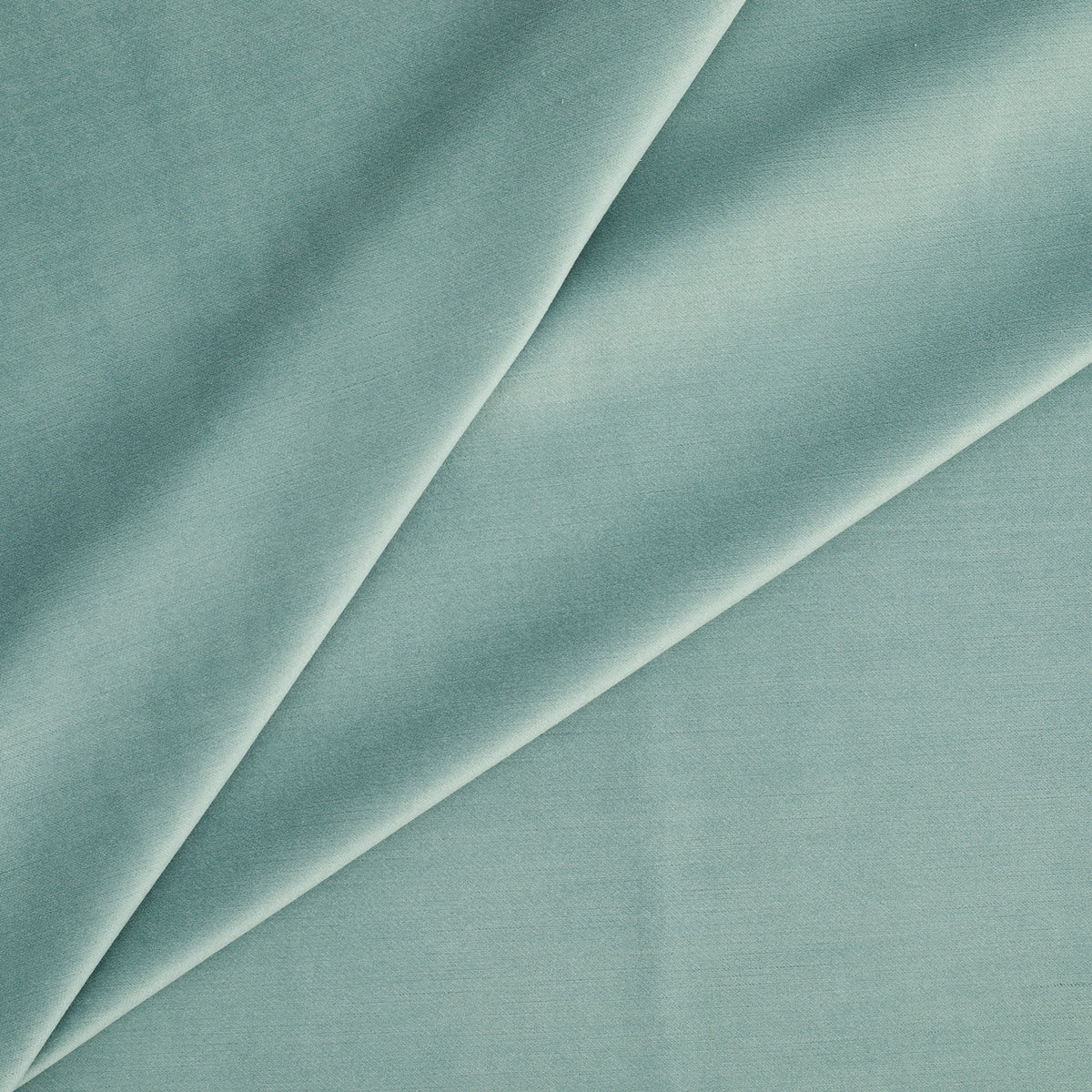 Tonic Living Sterling Velvet Lake upholstery fabric featuring a soft turquoise and robin’s egg blue velvet with subtle linear texture.