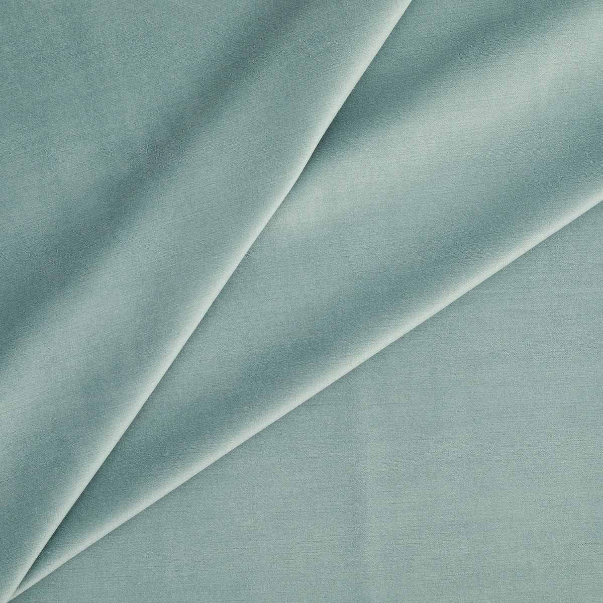 Tonic Living Sterling Velvet Lake upholstery fabric featuring a soft turquoise and robin’s egg blue velvet with subtle linear texture.