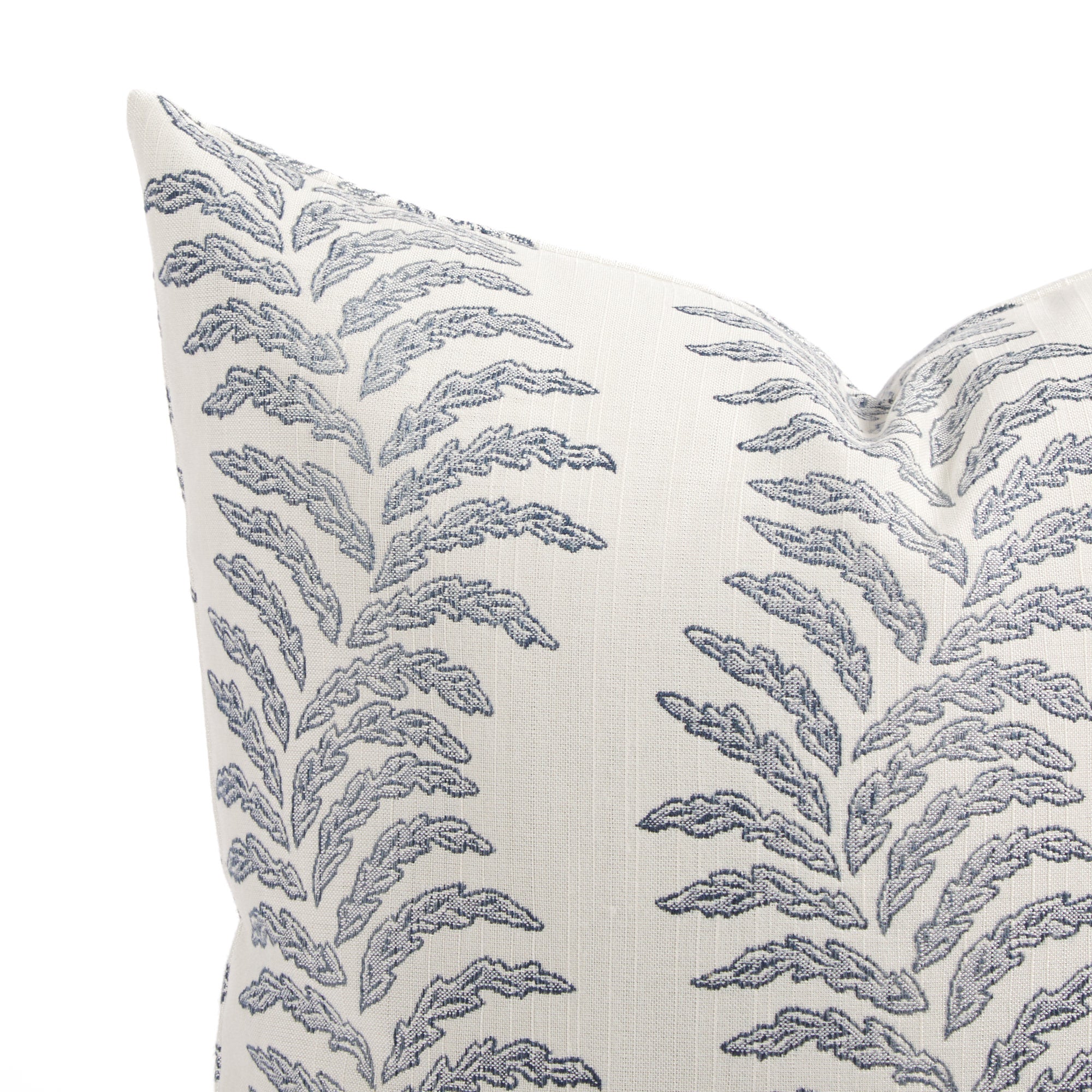 Close up of Tonic Living Swoon outdoor cushion showing blue and white stylized fern stripe detail.