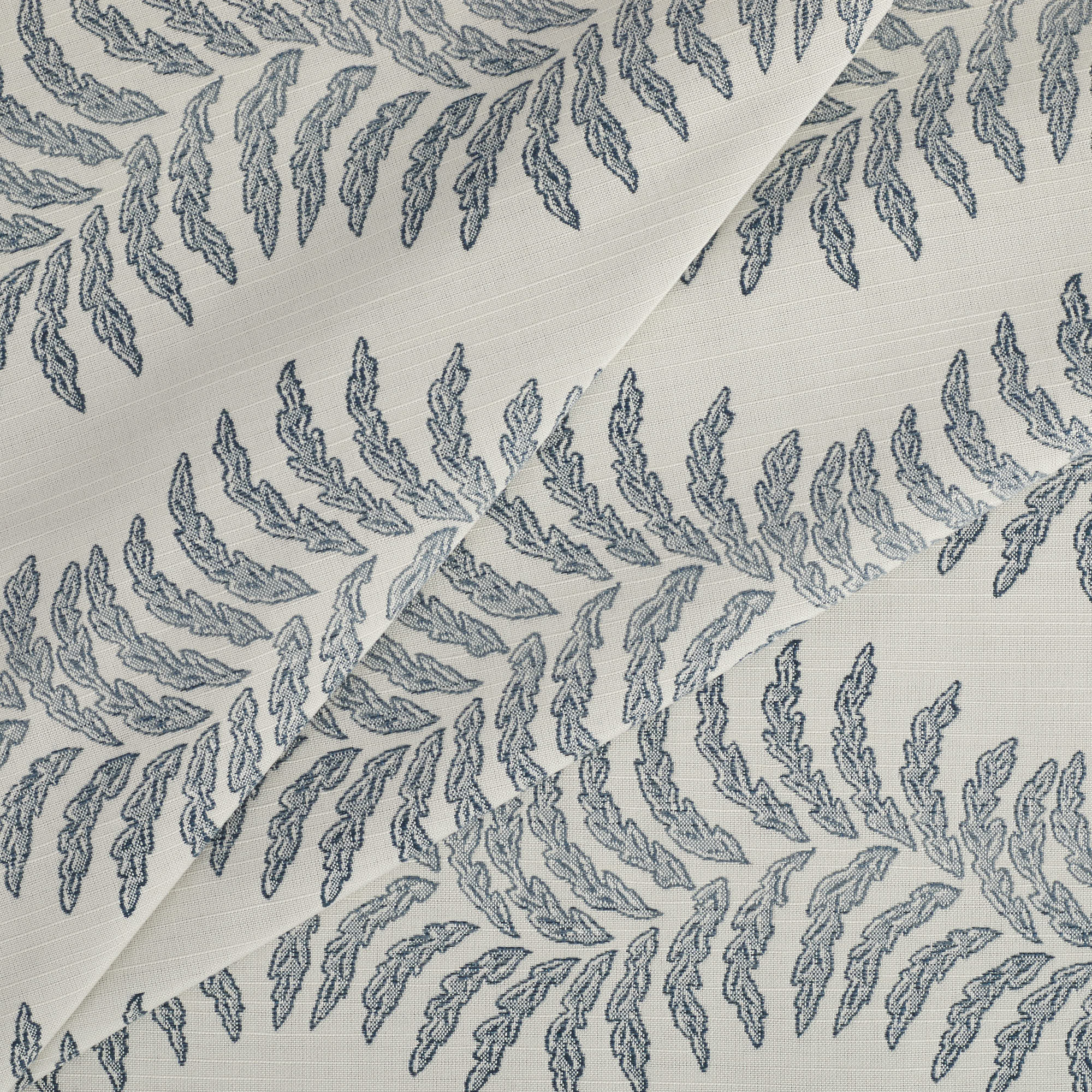 Tonic Living Swoon Sunbrella Denim fabric featuring a soft botanical stripe in blue and white tones.