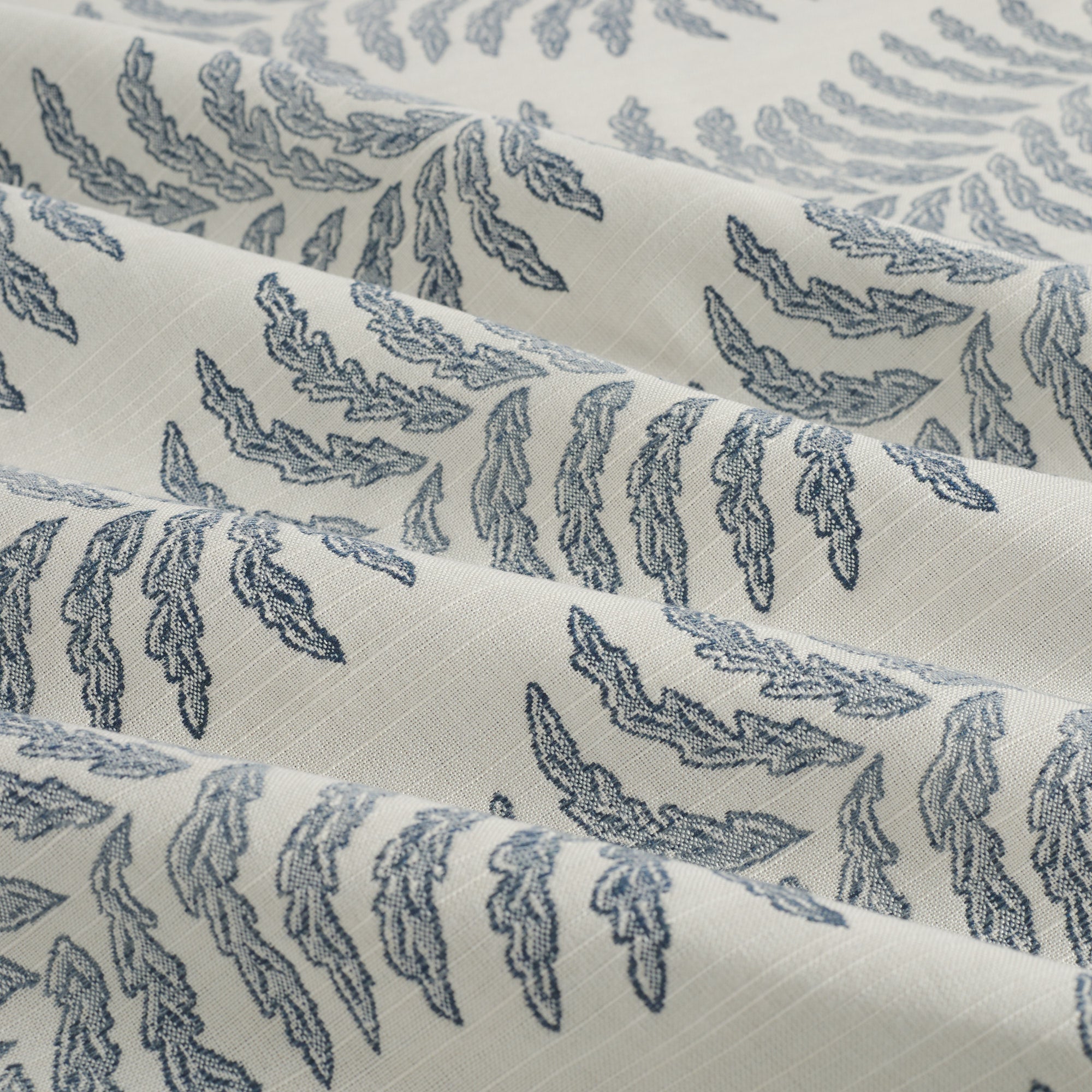 Tonic Living Swoon Sunbrella Denim indoor/outdoor upholstery fabric with an organic fern stripe design.