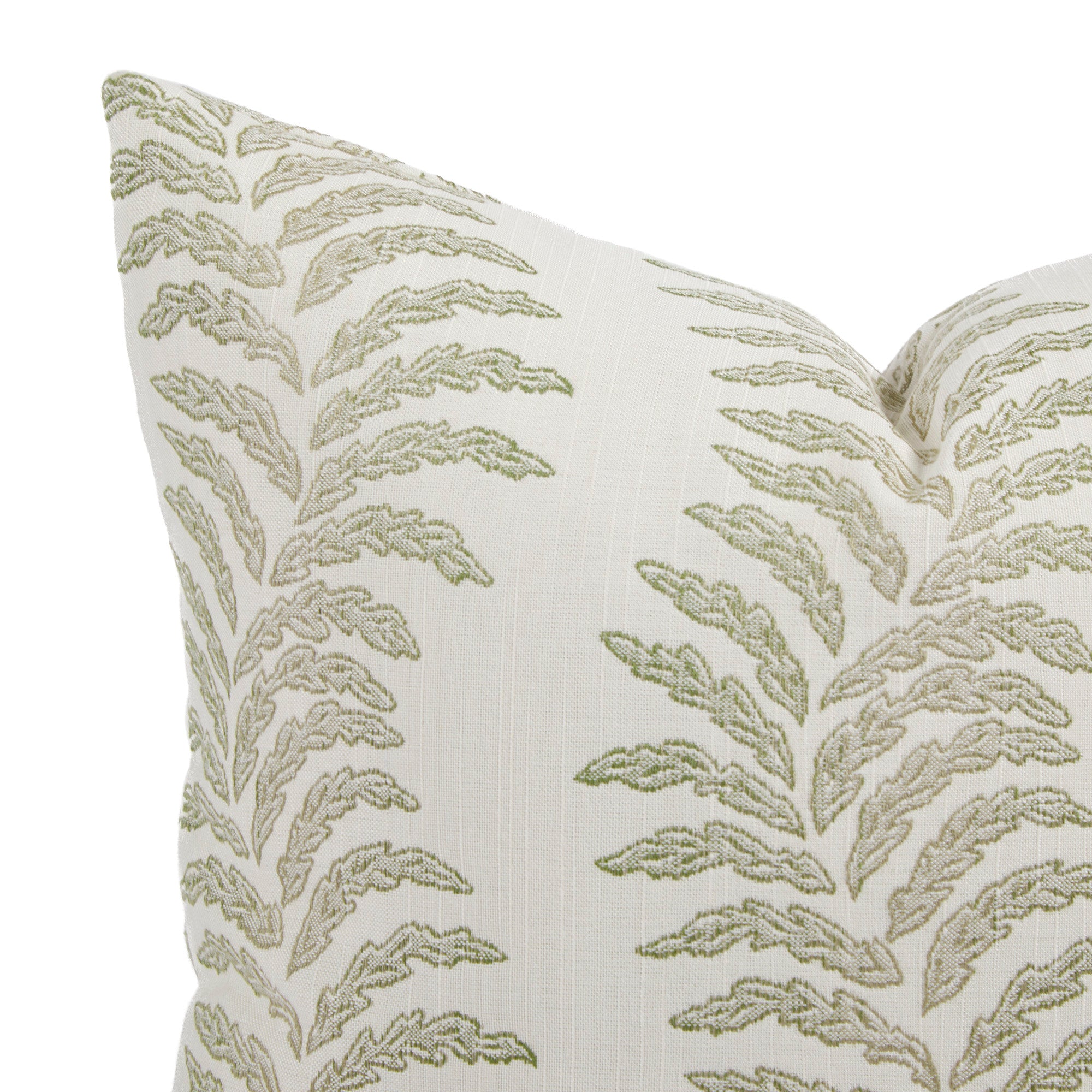 Close up of Tonic Living Swoon outdoor pillow showing sage green and white botanical stripe detail.