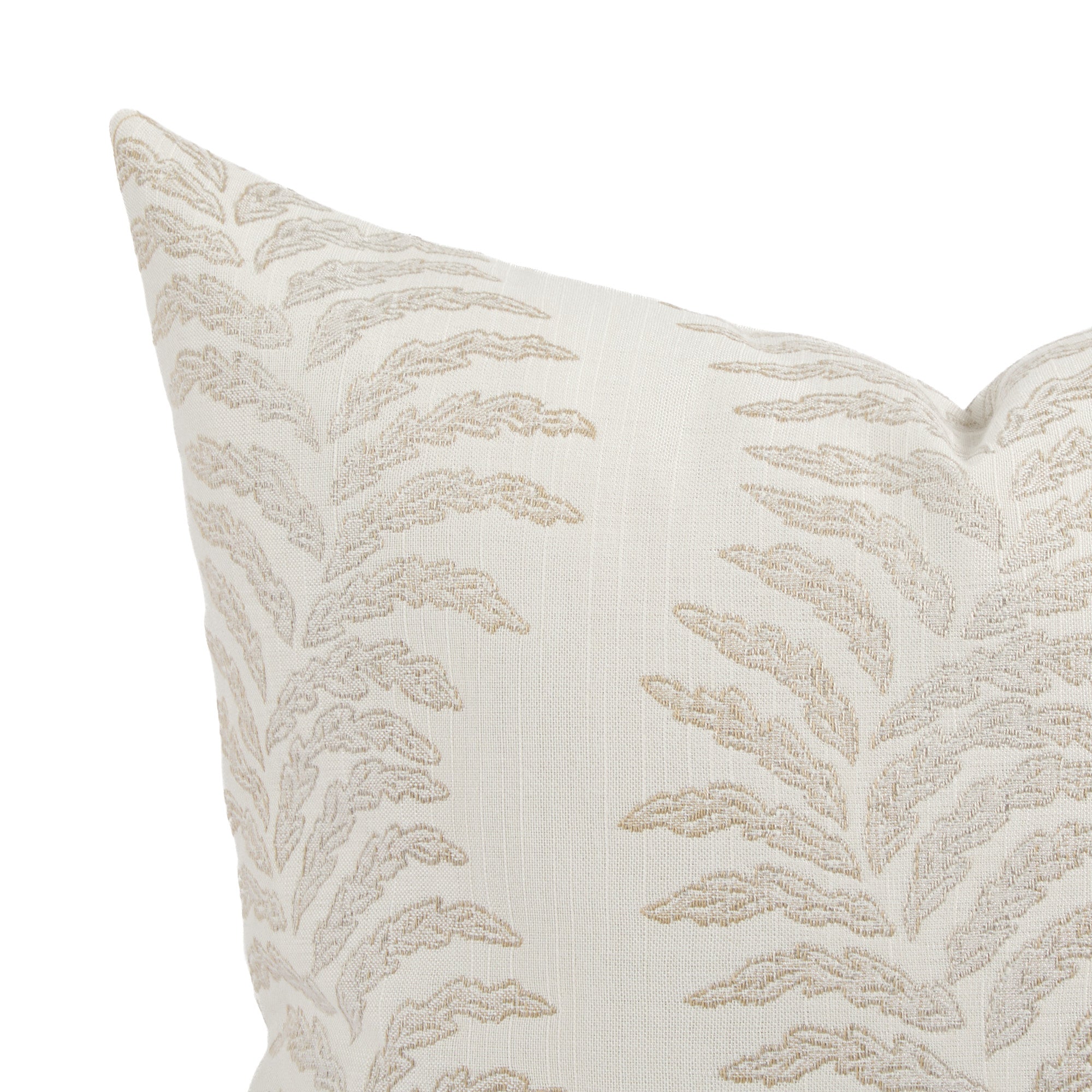 Close up of Tonic Living Swoon outdoor pillow showing beige and white botanical stripe detail.